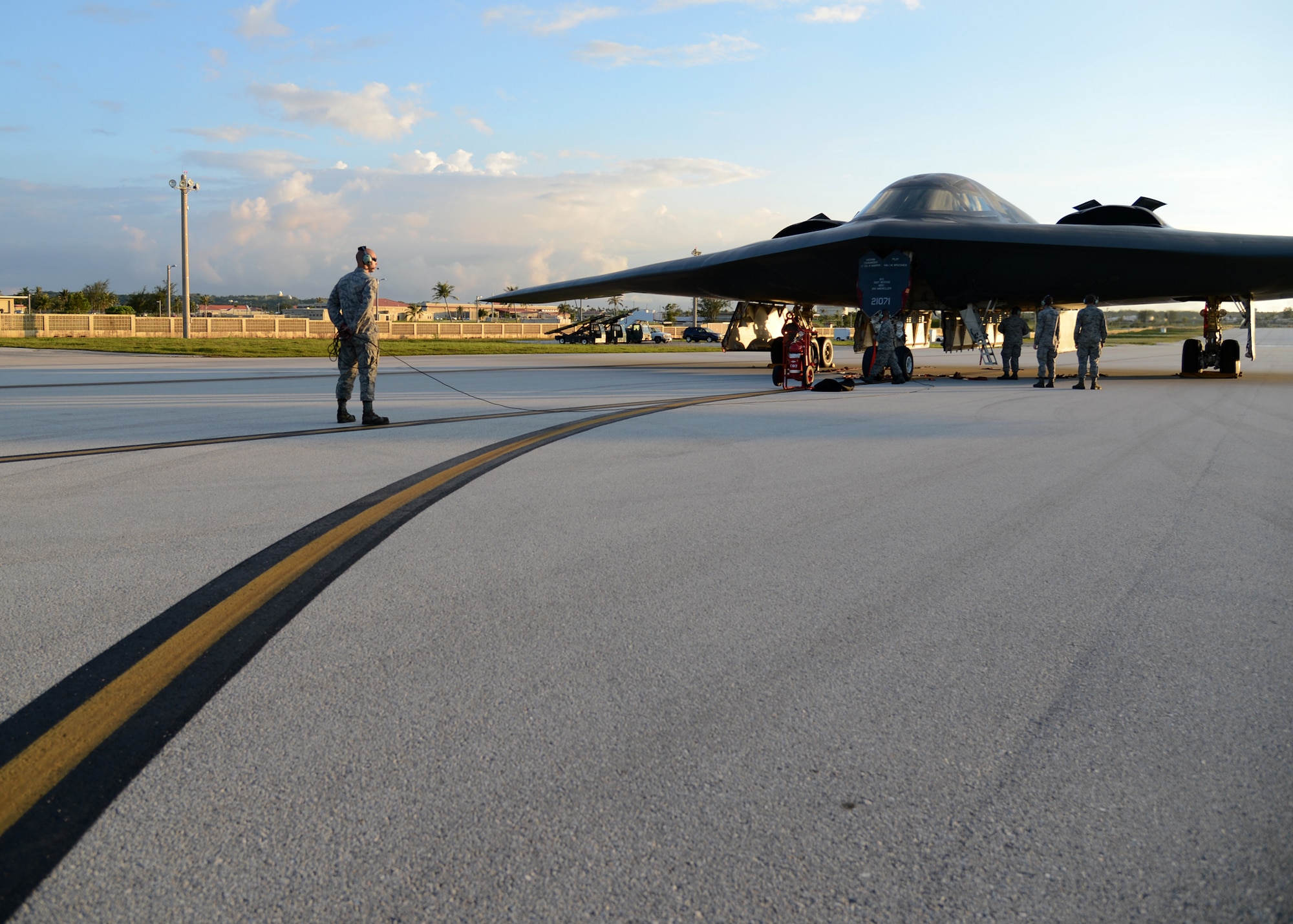 Staff Sgt. Clay Walton, 509th Aircraft Maintenance Squadron crew chief, Whiteman Air Force Base, Mo., conducts post-flight inspections on a B-2 Spirit bomber at Andersen Air Force Base, Guam, Aug. 25, 2015. Whiteman deployed approximately 225 Airmen and three B-2s here to conduct familiarization training in the Indo-Asia-Pacific region. (U.S. Air Force photo by Senior Airman Joseph A. Pagán Jr./Released)