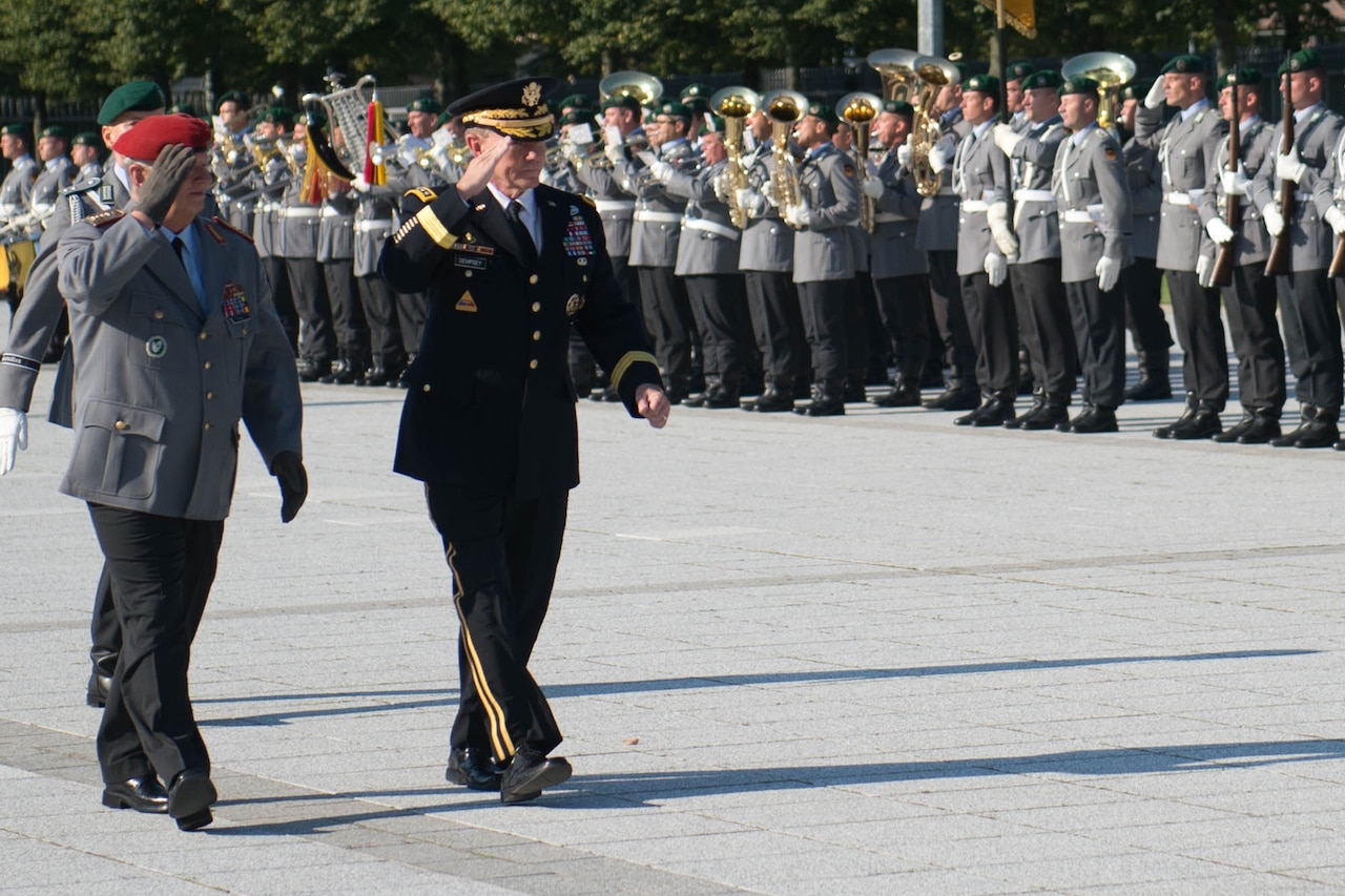 Army Gen. Martin E. Dempsey, chairman of the Joint Chiefs of Staff, and German Army Gen. Volker Wieker, chief of defense, salute during a pass-and-review ceremony of the German honor guard at the Ministry of Defense in Berlin, Sept. 10, 2015. DoD photo by D. Myles Cullen