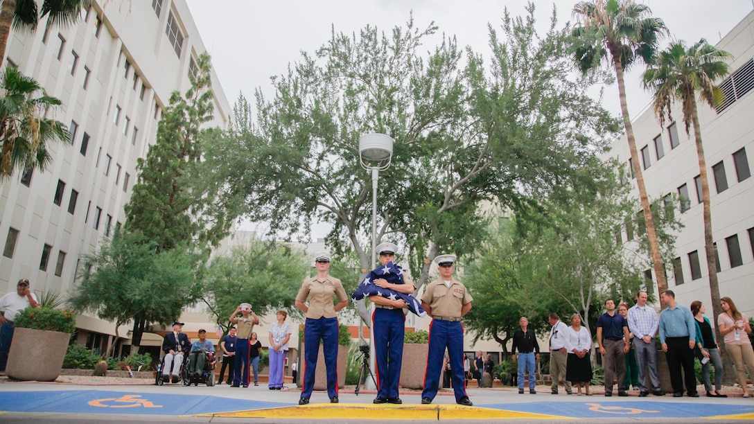Marines and sailors visit veterans at the Carl T. Hayden VA Medical Center in Phoenix, Sept. 10, 2015. Marine musicians played several pieces including the “National Anthem” while Marines raised the flag at the front of the hospital.