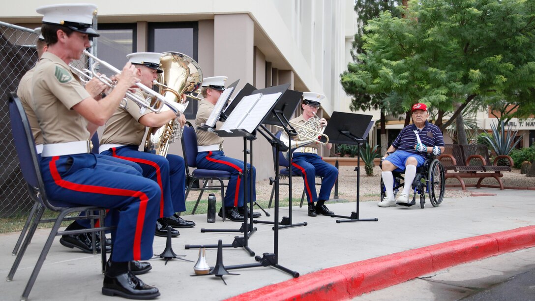 1st Sgt. Cecilio Vallejoi, USMC (Ret), listens to Marine musicians perform at the Carl T. Hayden VA Medical Center, Phoenix, Sept. 10, 2015. Marine Week Phoenix is a chance to reconnect with Marines, sailors, veterans and their families from different generations.