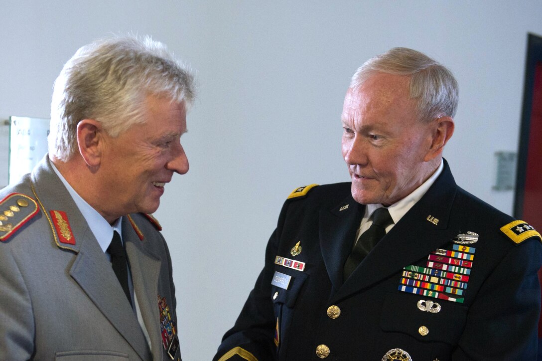 U.S. Army Gen. Martin E. Dempsey, right, chairman of the Joint Chiefs of Staff, talks with the chief of staff of the German armed forces, Gen. Volker Wieker, at the German Ministry of Defense in Berlin, Sept. 10, 2015. DoD photo by D. Myles Cullen