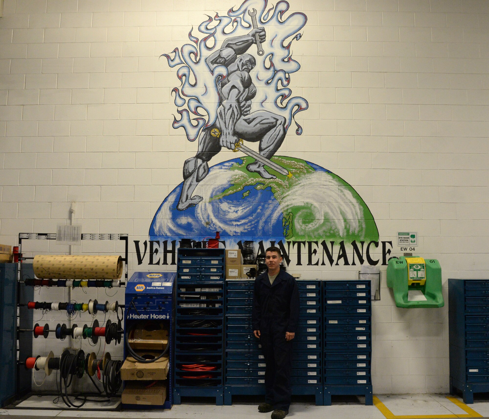 U.S. Air Force Senior Airman Steven Venegas, a 354th Logistics Readiness Squadron firefighting and refueling vehicle and equipment maintenance journeyman, poses in front of the vehicle maintenance globe, Sept. 10, 2015, at Eielson Air Force Base, Alaska. Venegas said his favorite part of the job is when his flight is able to work together at a moment’s notice. (U.S. Air Force photo by Airman 1st Class Cassandra Whitman/Released)