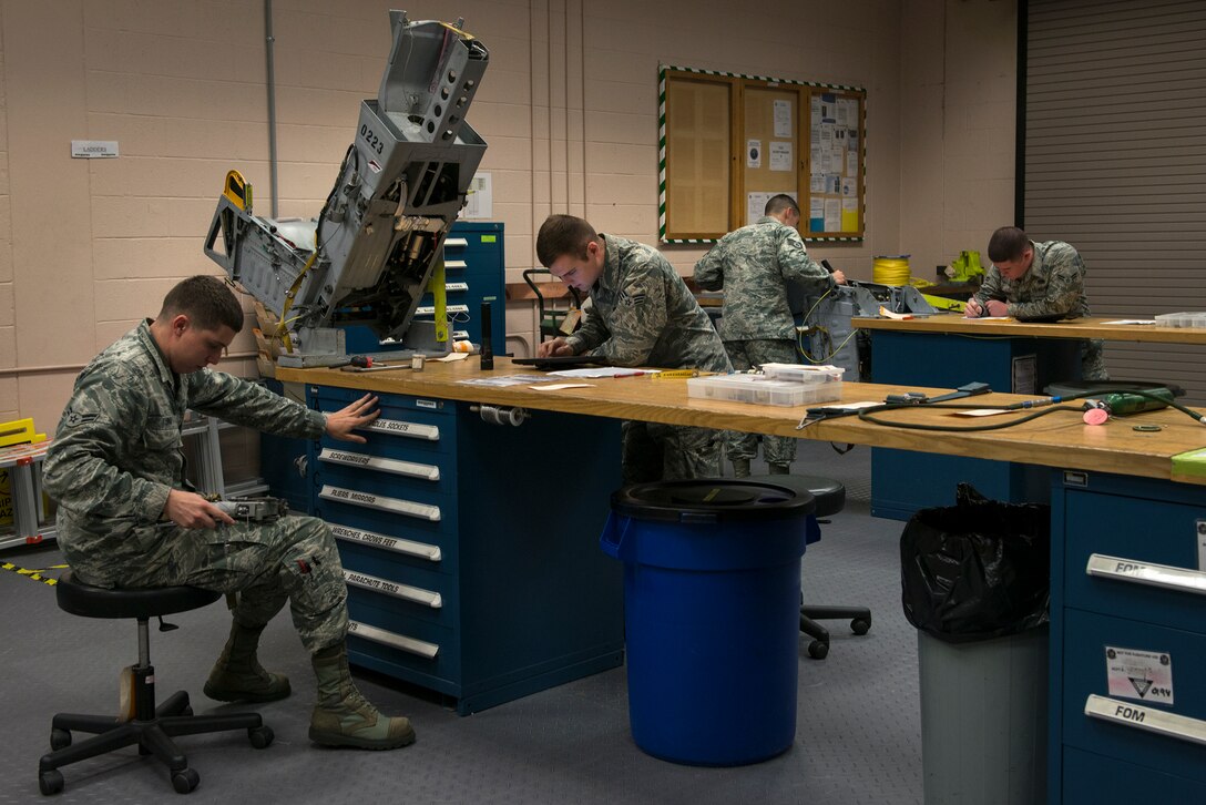 Airmen from the 23d Component Maintenance Squadron and 476th Maintenance Squadron perform inspections on ejection seats Sept. 2, 2015, at Moody Air Force Base, Ga. The egress Airmen maintain the seats from Moody’s A-10C Thunderbolt II aircraft to help ensure the pilot’s safety during an in-flight emergency. (U.S. Air Force photo by Airman 1st Class Kathleen D. Bryant/Released)


