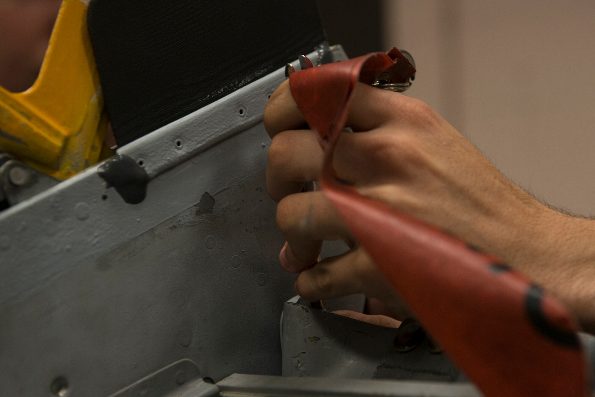 U.S. Air Force Senior Airman Jacob Beck, 23d Component Maintenance Squadron aircrew egress systems journeyman, replaces a left-hand side cap on an ejection seat Sept. 2, 2015, at Moody Air Force Base, Ga. Airmen in the egress shop are required to perform inspections at a minimum of every 36 months on each seat of Moody’s A-10C Thunderbolt II aircraft to check for efficiency. (U.S. Air Force photo by Airman 1st Class Kathleen D. Bryant/Released)

