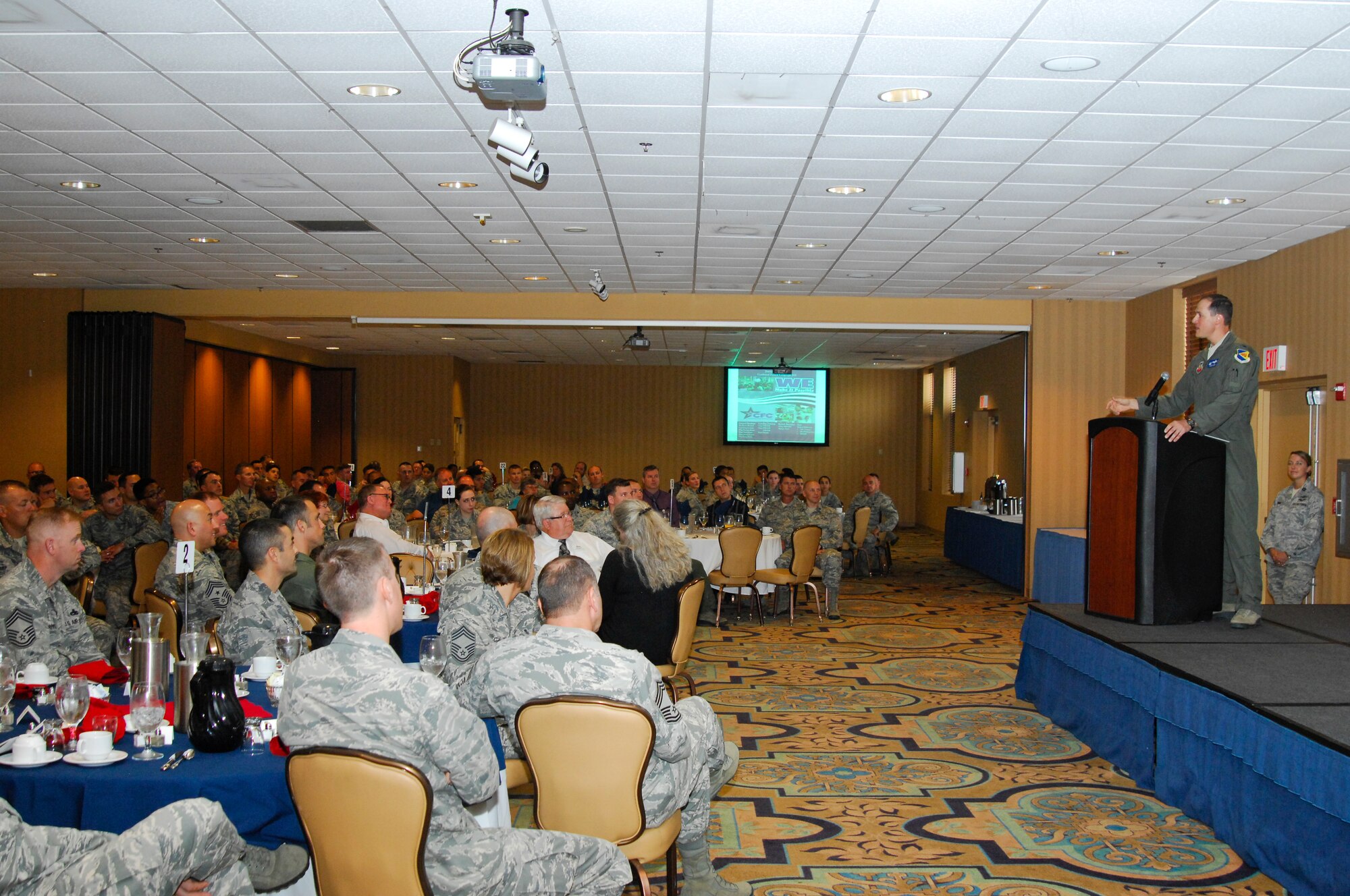U.S. Air Force Col. James Meger, 355th Fighter Wing commander, speaks to Desert Lightning Team Airmen during the Combined Federal Campaign kickoff breakfast at Davis-Monthan Air Force Base, Ariz., Sept. 10, 2015. The CFC was created in 1961 to coordinate the fundraising efforts of various charitable organizations so that federal donors would only be solicited once throughout the year. (U.S. Air Force photo by Staff Sgt. Angela Ruiz/Released) 