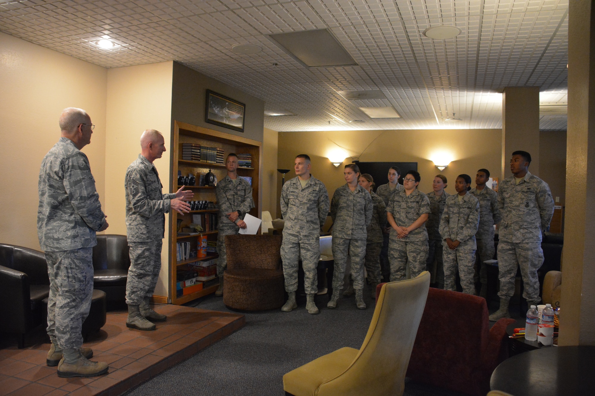 Col. Robert Cannon, 60th Air Mobility Wing chaplain and Chief Master Sgt. Alan Boling, 60th AMW command chief, recognize the Peak Leadership Team Sept. 8 at Travis Air Force Base, Calif. The Peak, an all-volunteer Airmen-run café, provides a place for Airmen in the dorms to meet other Airmen and enjoy free refreshments. (U.S. Air Force photo by Airman 1st Class Amber Carter)