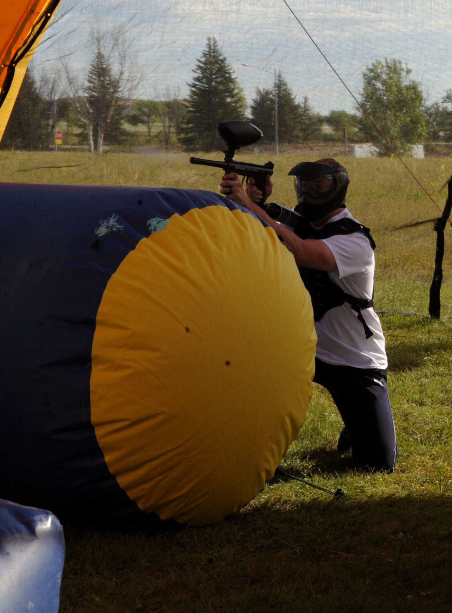 An Ellsworth Airman competes in a round of paintball during Comprehensive Airman Fitness Day at Ellsworth Air Force Base, S.D., Sept. 3, 2015. CAF day activities focused on physical fitness and included a 5K run, basketball, soccer and volleyball, among other events. (U.S. Air Force photo by Airman 1st Class Denise M. Nevins/Released)