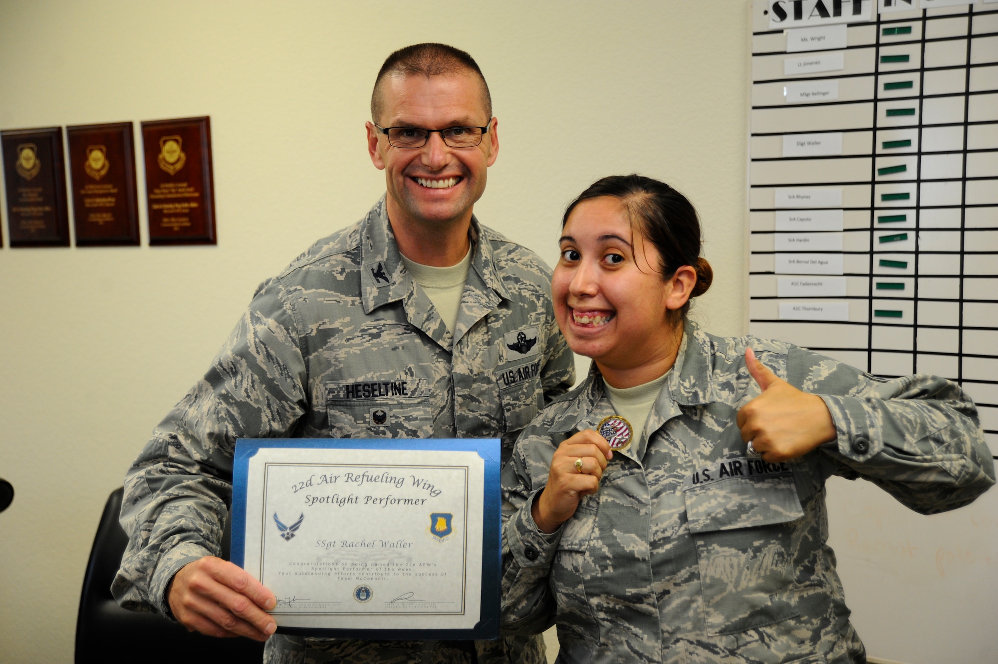 Staff Sgt. Rachel Waller, 22nd Air Refueling Wing Public Affairs command information NCO in charge, poses with Col. Phil Heseltine, 22nd Air Refueling Wing vice commander, Sept. 3, 2015, at McConnell Air Force Base, Kan. Waller was selected as the spotlight performer for the week of Aug. 23 – 29. (U.S. Air Force photo by Senior Airman Victor J. Caputo)