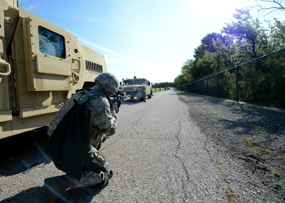 A 22nd Security Forces Squadron Airman returns fire during a training exercise, Sept. 3, 2105, at McConnell Air Force Base, Kan. The exercise covered different scenarios that could come up during a deployment, such as firefights while on patrol. (U.S. Air Force photo by Senior Airman Victor J. Caputo)