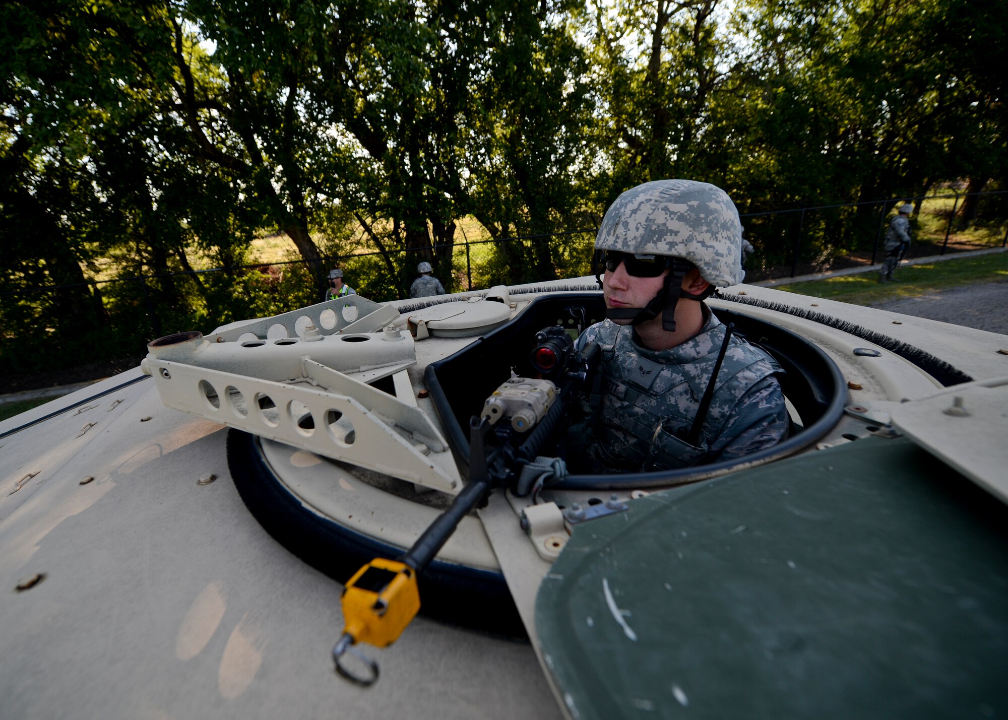 Airman 1st Class Richard Haskett, 22nd Security Forces Squadron patrolman, monitors his sector during a training exercise, Sept. 3, 2015, at McConnell Air Force Base, Kan. Several Defenders from the 22nd SFS went through the exercise to prepare them scenarios they could face during an upcoming deployment. (U.S. Air Force photo by Senior Airman Victor J. Caputo)