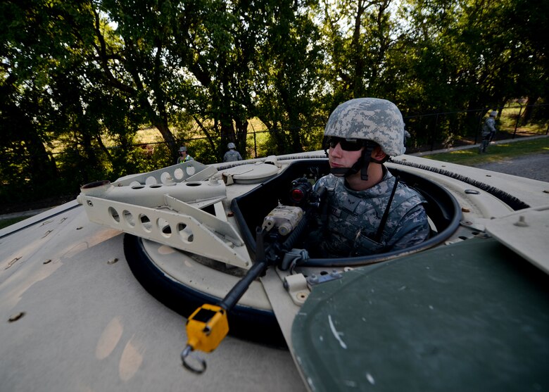 Airman 1st Class Richard Haskett, 22nd Security Forces Squadron patrolman, monitors his sector during a training exercise, Sept. 3, 2015, at McConnell Air Force Base, Kan. Several Defenders from the 22nd SFS went through the exercise to prepare them scenarios they could face during an upcoming deployment. (U.S. Air Force photo by Senior Airman Victor J. Caputo)