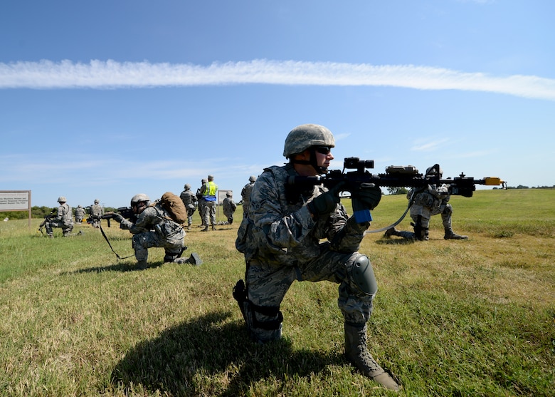 Airman 1st Class Richard Haskett, 22nd Security Forces Squadron patrolman, watches his patrol’s flank during a training exercise, Sept. 3, 2015, at McConnell Air Force Base, Kan. Haskett’s patrol was simulating a mission to obtain a high value target in a deployed environment. (U.S. Air Force photo by Senior Airman Victor J. Caputo)