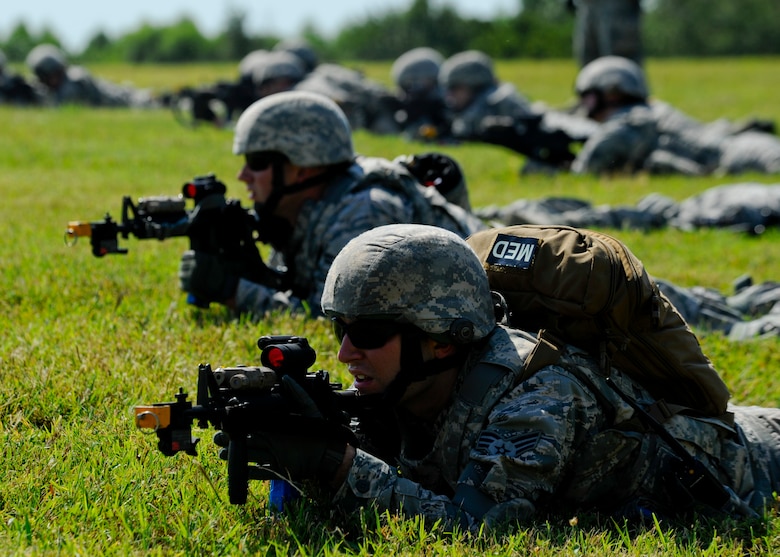 Patrolmen assigned to the 22nd Security Forces Squadron monitor an enemy position during a training exercise, Sept. 3, 2015, at McConnell Air Force Base, Kan. The Defenders were training for an upcoming deployment, covering scenarios not likely to be seen while at home station. (U.S. Air Force photo by Senior Airman Victor J. Caputo)