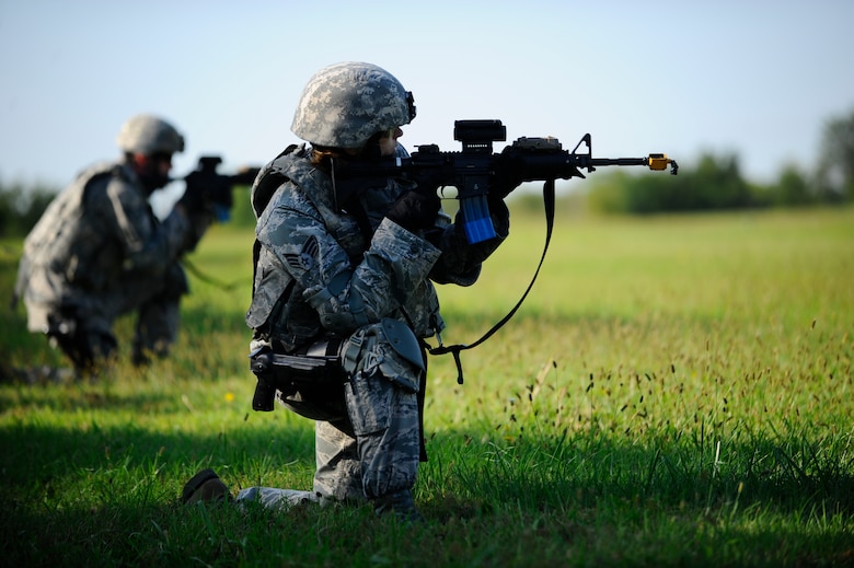 An Airman assigned to the 22nd Security Forces Squadron scans his sector during a simulated patrol, Sept. 3, 2015, at McConnell Air Force Base, Kan. Several Defenders with the 22nd SFS went through an intense training simulation in preparation for an upcoming deployment. (U.S. Air Force photo by Senior Airman Victor J. Caputo)