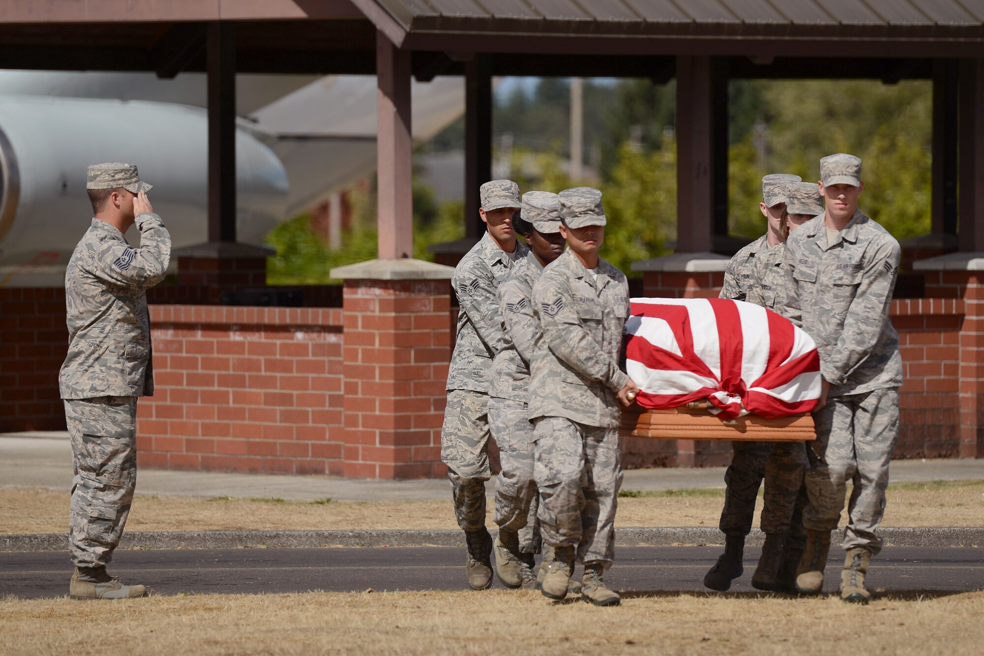 Airmen from the McChord Field Honor Guard carry a casket, Sept. 2, 2015, during a demonstration of an active duty honors ceremony at Joint Base Lewis-McChord, Wash. The ceremony concluded with a graduation ceremony for McChord Field Honor Guard’s newest Alpha Flight. (U.S. Air Force photo/Airman 1st Class Keoni Chavarria)