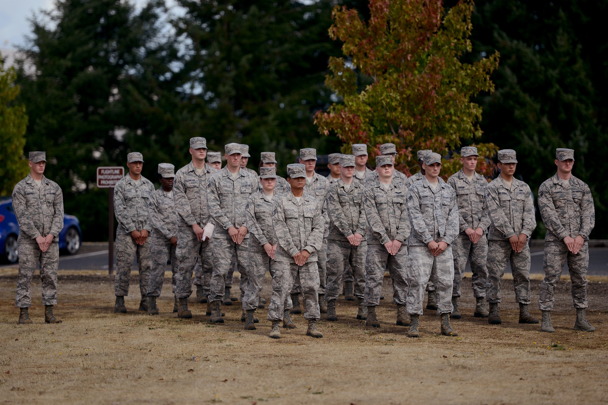 Graduating members of the McChord Field Honor Guard stand in formation, Sept. 2, 2015, during a graduation ceremony at Joint Base Lewis-McChord, Wash. During their two weeks of training, the honor guard Airmen learned proper procedures for ceremonies such as carrying a casket, folding a flag, and presenting the colors. (U.S. Air Force photo/Airman 1st Class Keoni Chavarria)