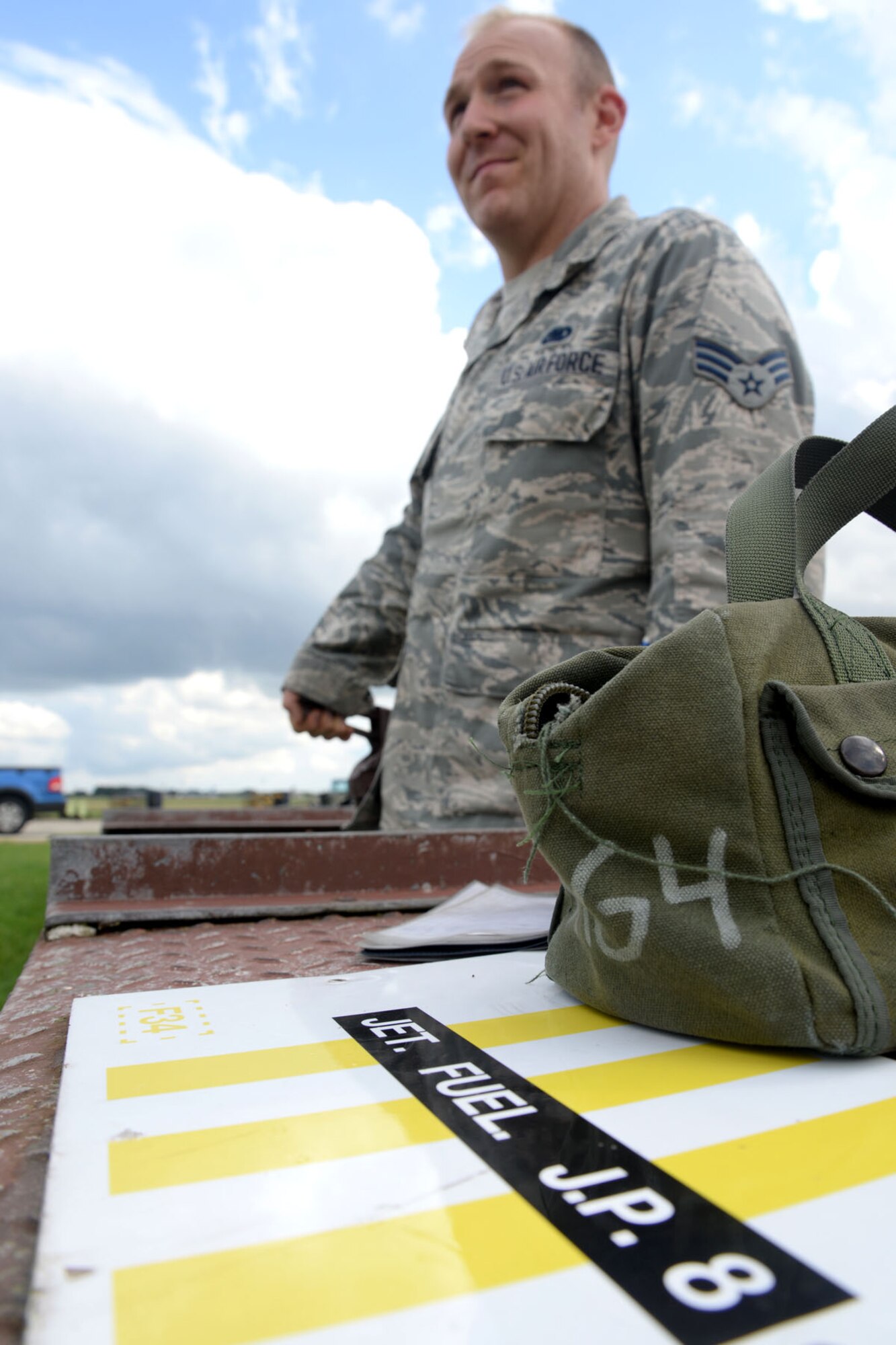 U.S. Air Force Senior Airman Nicholas Clendenen, 100th Logistics Readiness Squadron fuels technician, refuels a transient aircraft with Jet Petroleum grade 8 Sept. 1, 2015, on RAF Mildenhall, England. Fuels technicians sometimes hold the pump for over an hour to ensure aircraft are fueled for their missions. (U.S. Air Force photo by Senior Airman Kate Thornton/Released)