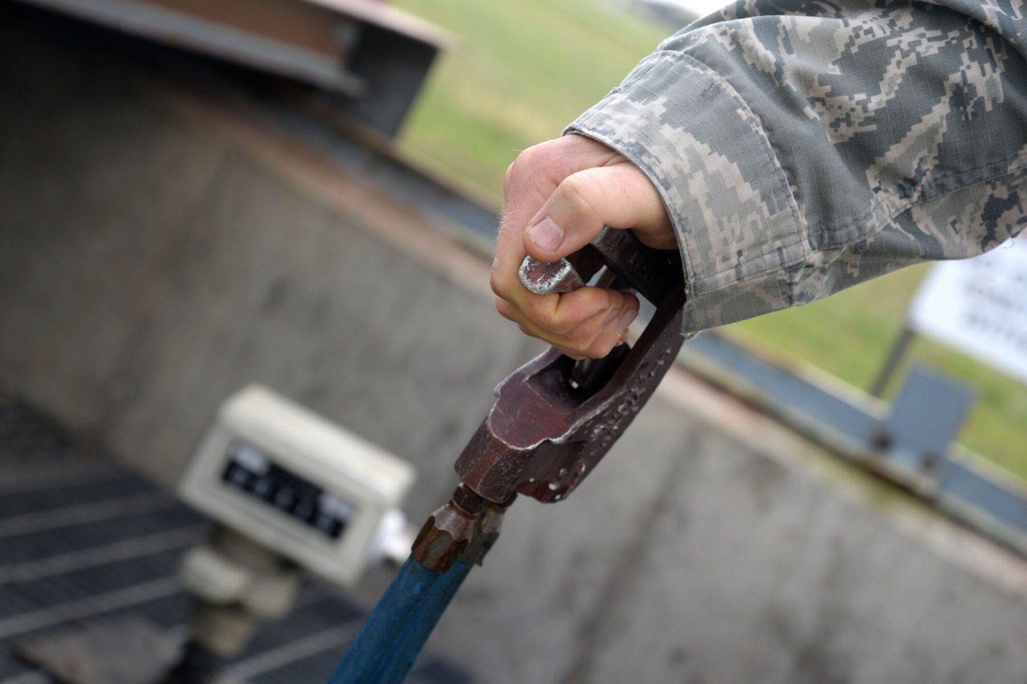U.S. Air Force Senior Airman Nicholas Clendenen, 100th Logistics Readiness Squadron fuels technician, pumps fuel to a transient aircraft Sept. 1, 2015, on RAF Mildenhall, England. Fuels technicians sometimes hold the pump for over an hour to ensure aircraft are fueled for their missions. (U.S. Air Force photo by Senior Airman Kate Thornton/Released)