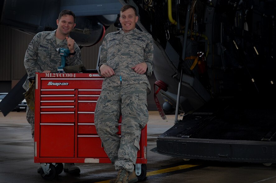 U.S. Air Force Staff Sgt. Blake Broekhove, left, and U.S. Air Force Staff Sgt. Scott Caldwell, 352nd Special Operations Maintenance Squadron CV-22 Osprey crew chiefs, stand near a CV-22 while on the flightline Sept. 1, 2015, on RAF Mildenhall, England. Caldwell and Broekhove put their military training skills to work Aug. 15, 2015, by performing CPR as a team on an injured community member. (U.S. Air Force photo by Senior Airman Victoria H. Taylor/Released)