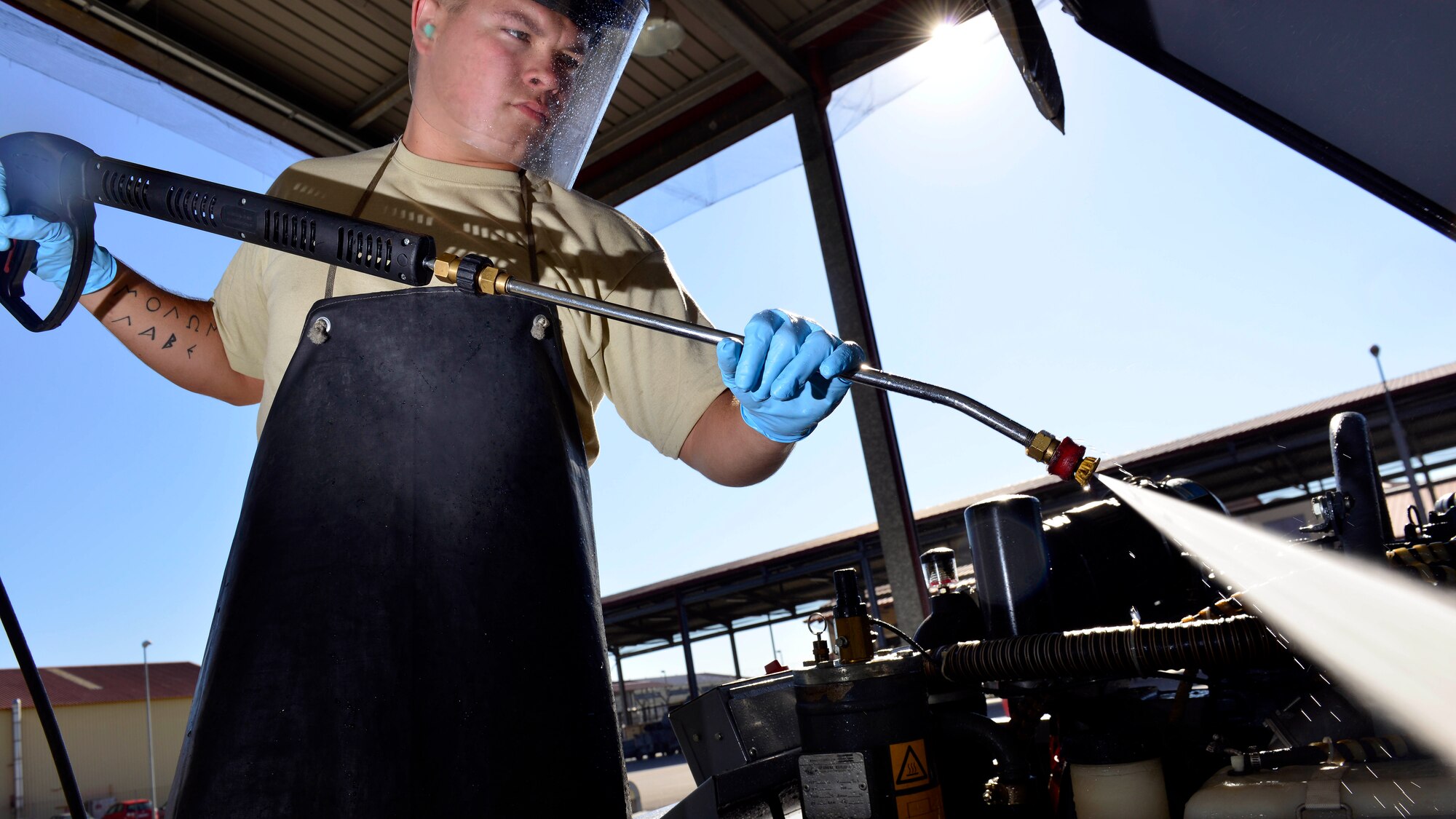 U.S. Air Force Senior Airman Quinton Littell, 31st Maintenance Squadron Aerospace Ground Equipment journeyman, cleans an air compressor prior to inspection, Sept. 8, 2015, at Aviano Air Base, Italy. Air compressors are inspected every six months for serviceability and are used on the flightline for tools. (U.S. Air Force photo by Airman 1st Class Cary Smith/Released) 