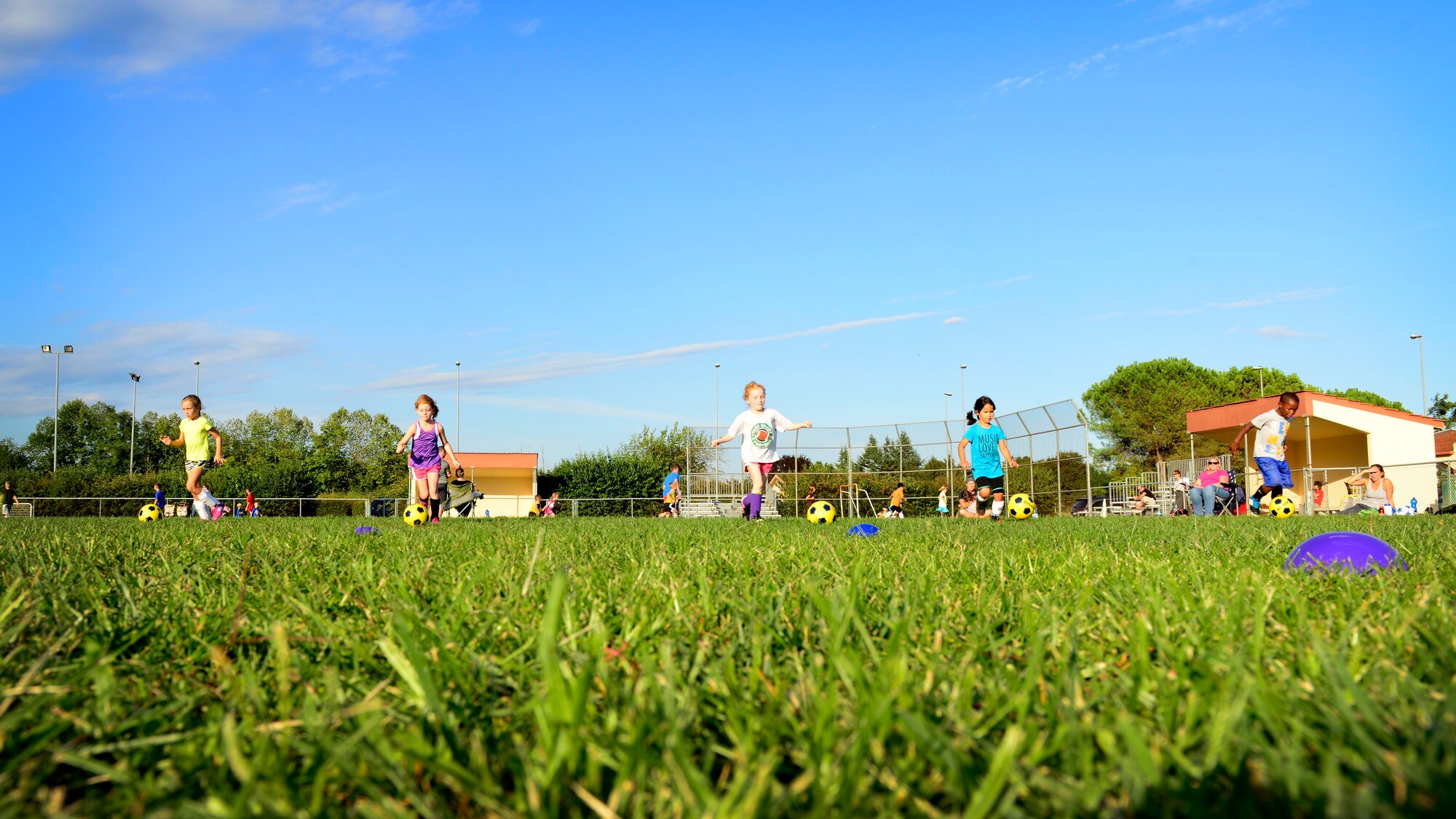 Team Aviano youth dribble and control soccer balls during practice, Sept. 8, 2015, at Aviano Air Base, Italy. The Aviano Youth Program hosts soccer practice for different age groups twice a week. The soccer season, which ends Oct. 31, is the largest AYP program with more than 300 participants. (U.S. Air Force photo by Senior Airman Areca T. Bell/Released)