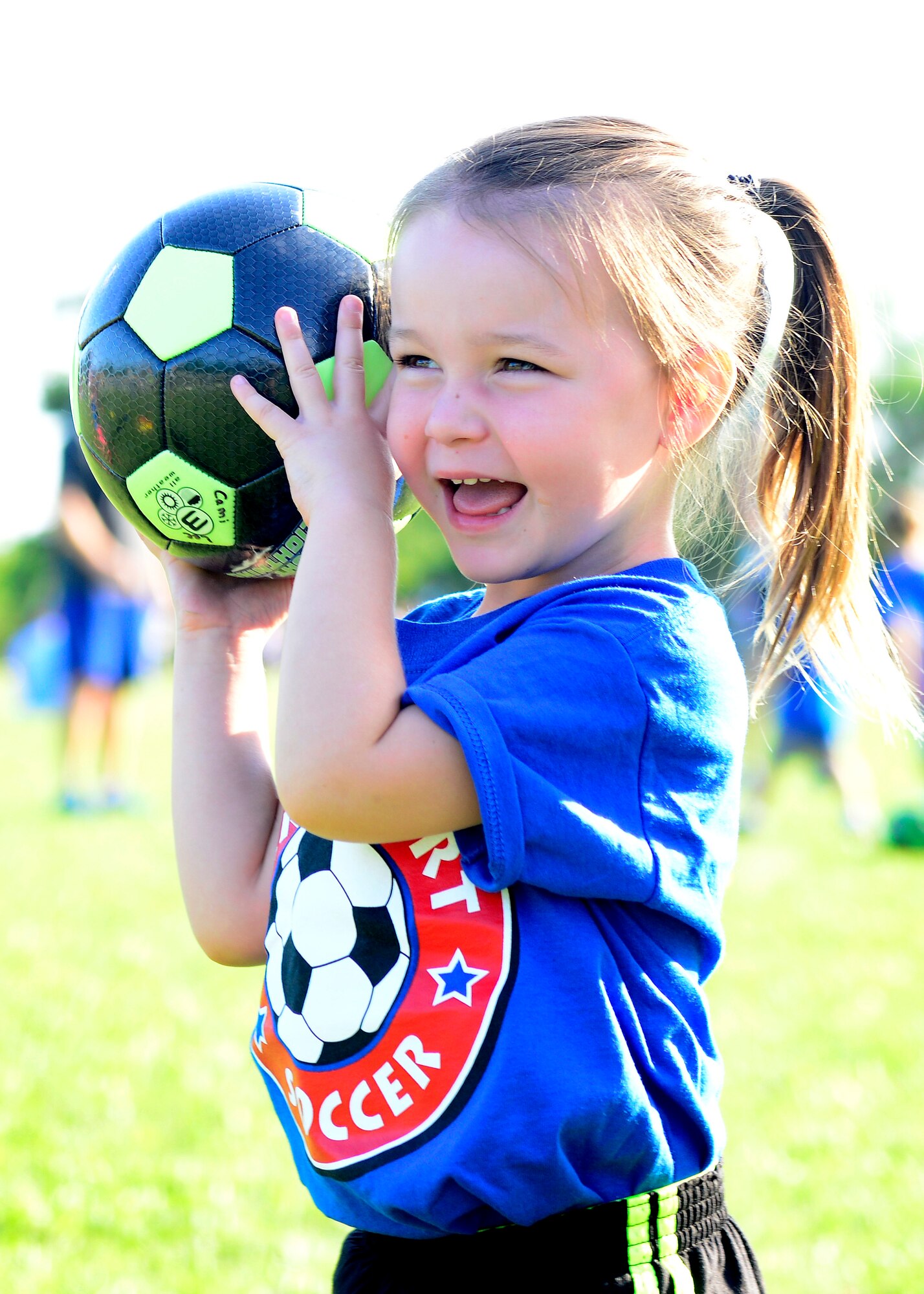 Ava Metivier throws a soccer ball during “Smart Start” Sept. 8, 2015 at Aviano Air Base, Italy. The Aviano Youth Program hosts two separate Smart Start sessions per week, which allows parents and children to get familiarized with soccer. Additionally, AYP offers children an opportunity to gain skills at an early age in sports such as basketball, baseball and flag football. (U.S. Air Force photo by Senior Airman Areca T. Bell/Released)