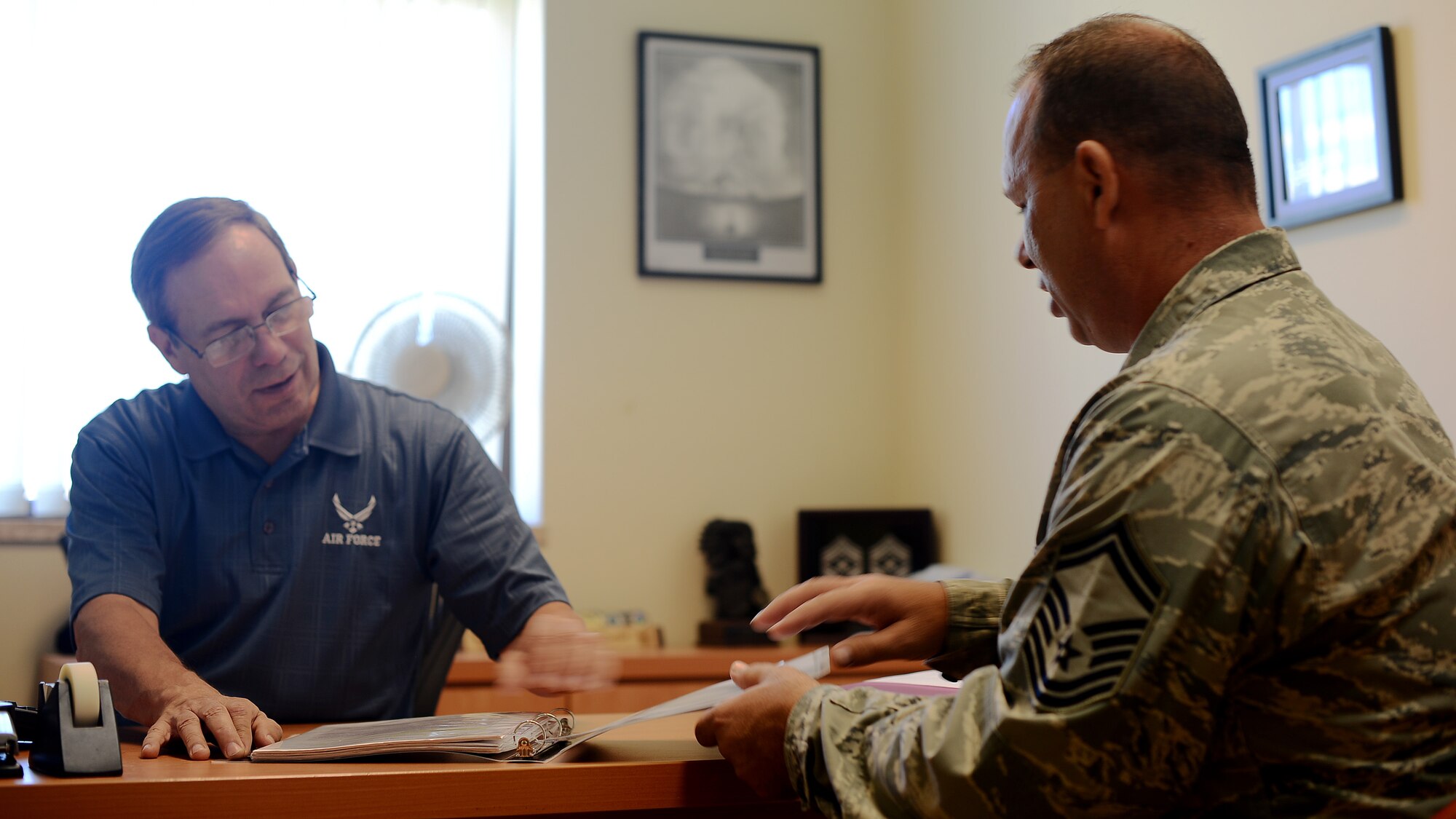 Don Schroeder, 31st Force Support Squadron Airman and Family Readiness Center community readiness specialist, meets with U.S. Air Force Senior Master Sgt. Greg Seeger, 724th Air Mobility Squadron superintendent, to discuss retirement planning. Seeger recently completed the week-long Transition Assistance Program to gain knowledge and information to prepare him for his upcoming retirement. (U.S. Air Force photo by Staff Sgt. R.J. Biermann/Released)