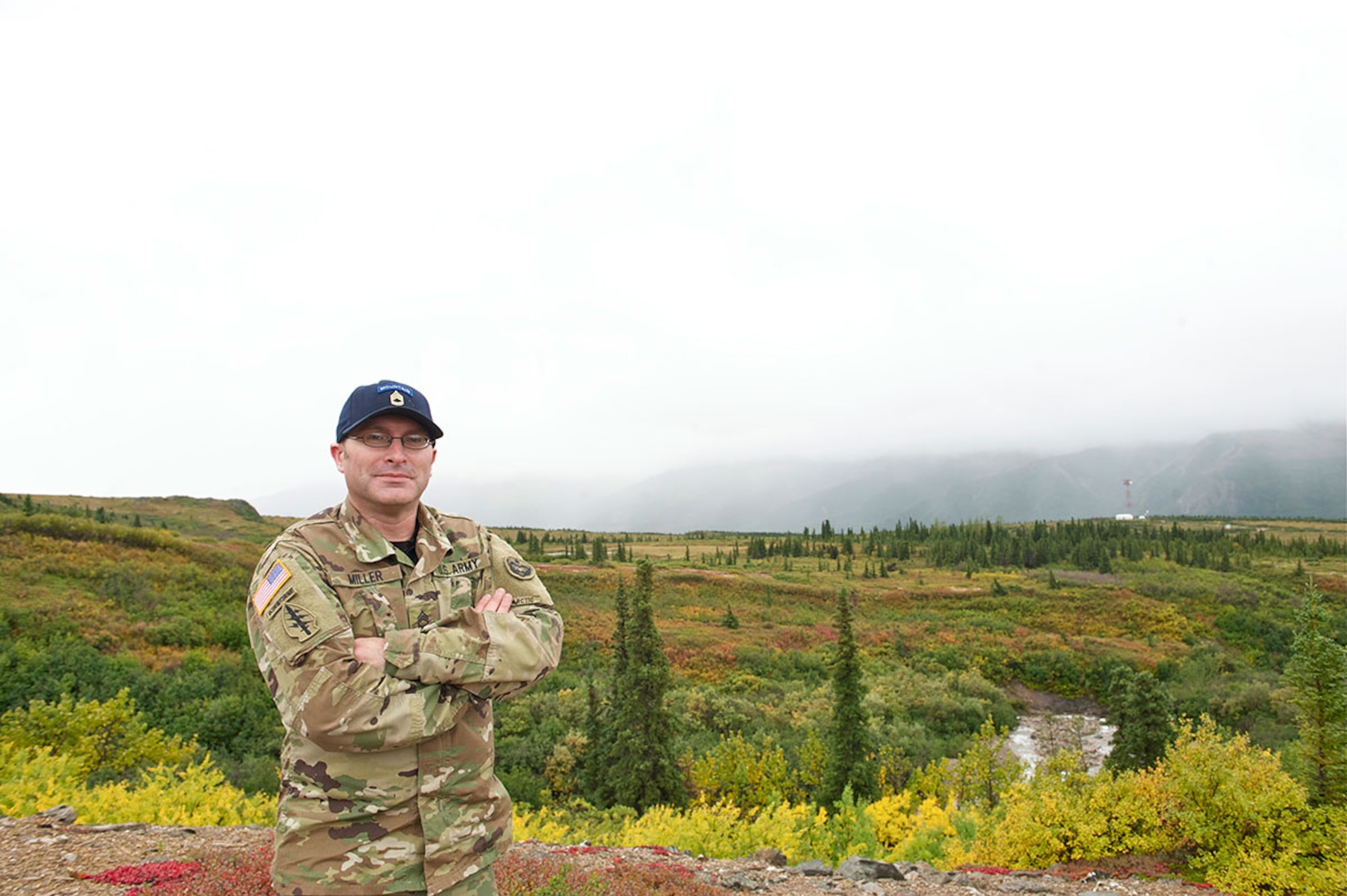 Sgt. 1st Class Ken Miller stands outside the Black Rapids Training Site Aug. 27, 2015, in Black Rapids, Alaska. Miller recently traveled to Chile to attend a 16-day course that taught summer and winter mountaineering operations. (U.S. Army photo/Sachel S. Harris)