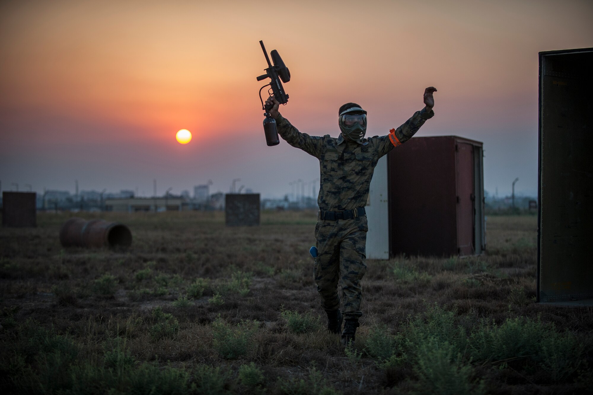 Muhammad Kurkcu, 10th Tanker Base Command airman, raises his hands in celebration of winning a paintball game Sept. 3, 2015, at Incirlik Air Base, Turkey. The event was designed to help build and strengthen relationships between the U.S. and Turkish forces. (U.S. Air Force photo by Airman 1st Class Cory W. Bush/Released)