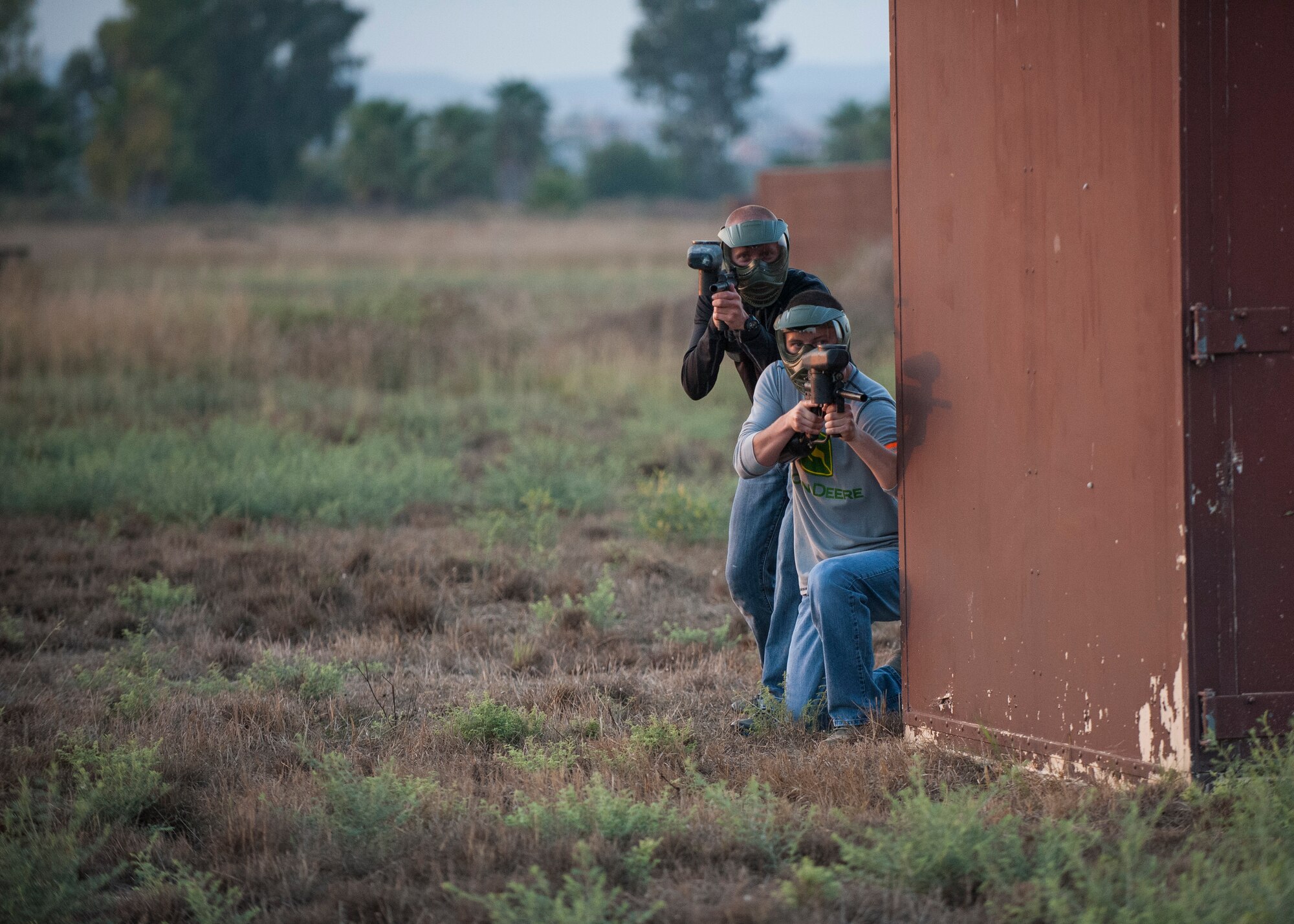 Senior Airman Charles Platt, 39th Security Forces Squadron unit scheduler, and Airman Mitchell Nardi, 39th SFS patrolman, engage in a paintball game Sept. 3, 2015, at Incirlik Air Base, Turkey.  The service members played multiple paintball games to include five vs. five, capture the flag and last man standing.  (U.S. Air Force photo by Airman 1st Class Cory W. Bush/Released)