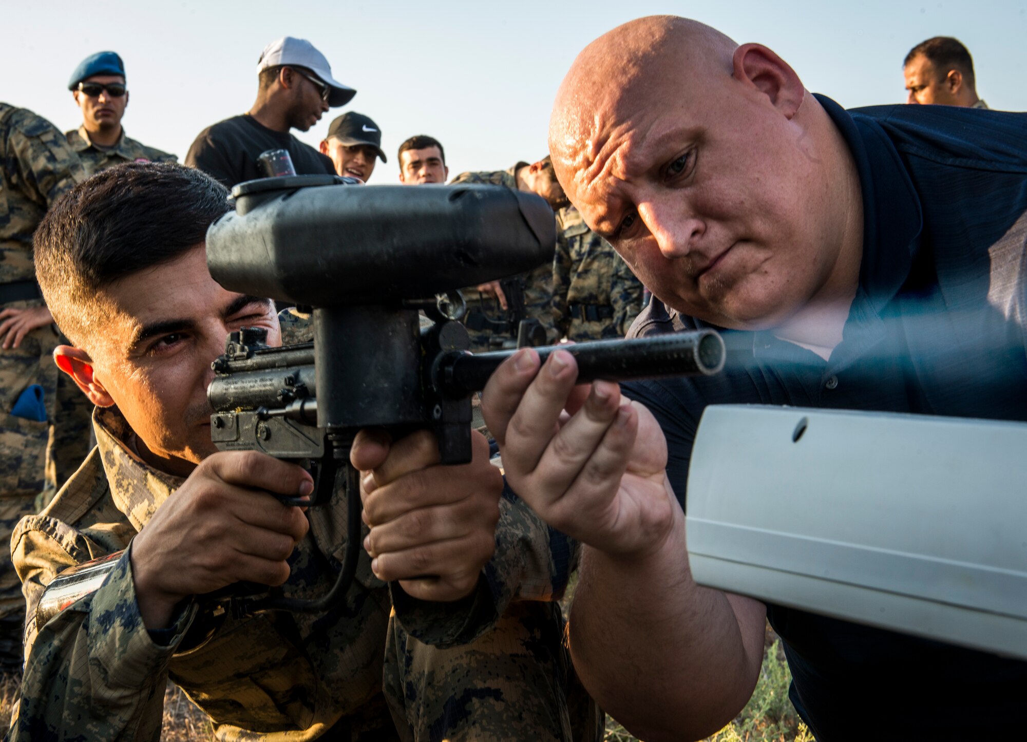 Halil Baykal (left), 10th Tanker Base Command airman and Tom Graham (right), 39th Force Support Squadron Outdoor Recreation director, test the velocity of a paintball gun Sept. 3, 2015, at Incirlik Air Base, Turkey. Each participant used a chronometer to tune their paintball gun to the proper velocity in order to have a fair and safe match. (U.S. Air Force photo by Airman 1st Class Cory W. Bush/Released)