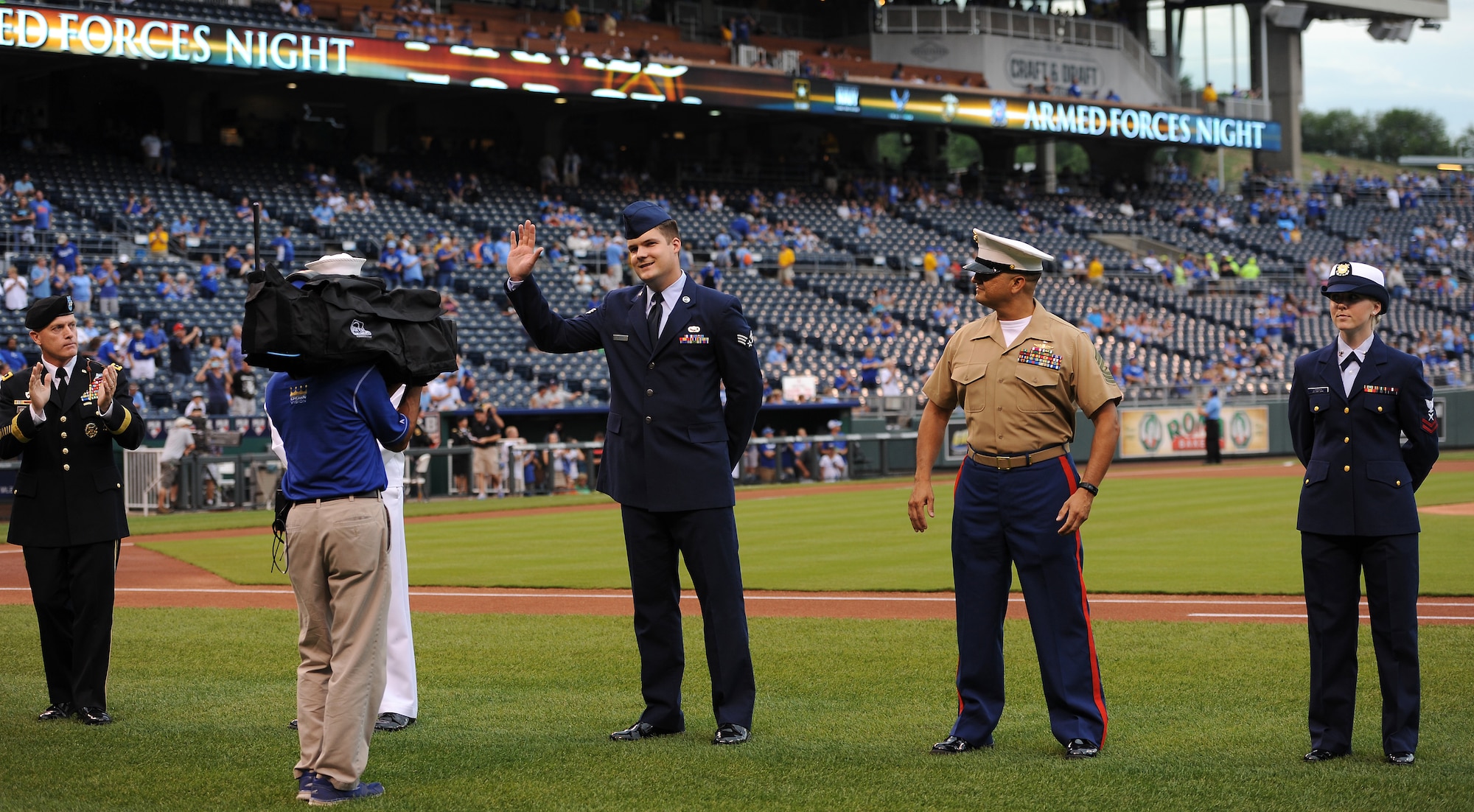 Senior Airman Mason Meherg, 509th Comptroller Squadron financial services technician, represents the U.S. Air Force at the Kansas City Royals’ Armed Forces Night at Kauffman Stadium in Kansas City, Mo., Sept. 7, 2015. One service member from each branch of the armed forces received a game ball from a Royals player during the pregame ceremony. (U.S. Air Force photo by Airman 1st Class Michaela R. Slanchik/Released)