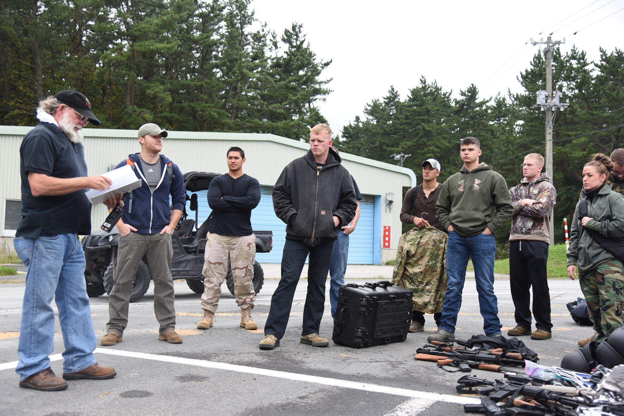 35th Fighter Wing volunteers are briefed by a safety instructor prior to a combat survival training exercise at Draughon Range, Japan, Sept. 9, 2015. CSTs contain upwards of 30 role-players at a time simulating enemy combatants, who egressed pilots have to evade during a 24-hour period. (U.S. Air Force photo by Senior Airman Patrick S. Ciccarone/Released)