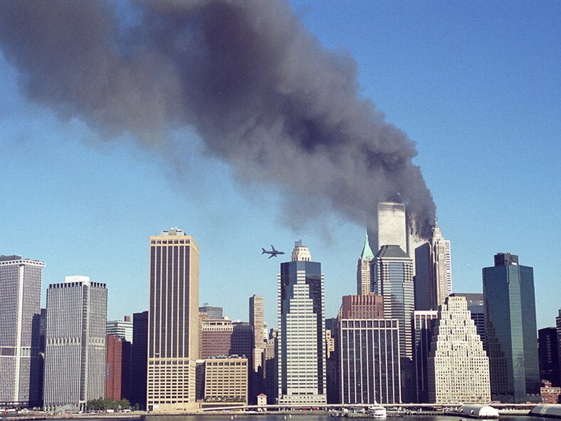 Flying the plane at 587 miles per hour, hijackers crash Flight 175 into the south face of floors 77 to 85 of the World Trade Center's South Tower, instantly killing the 60 on the plane and unknown hundreds within the tower. ( Photo courtesy of Kelly Guenther/Released)

