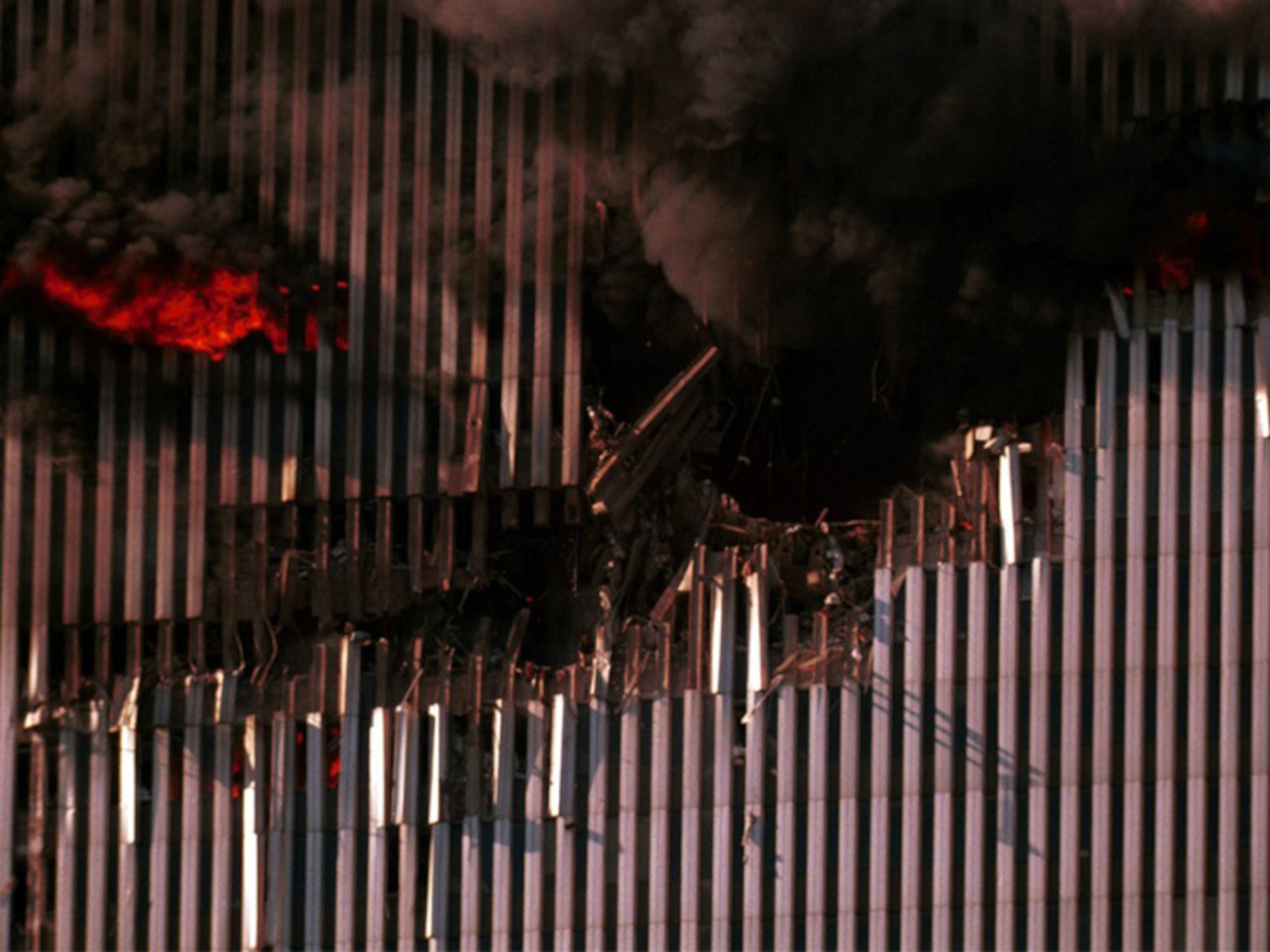 The impact severs all three emergency stairwells, trapping the nearly 1,400 people at work above the 91st floor. (Photograph by Roberto Rabanne From The Roberto Rabanne Archive)