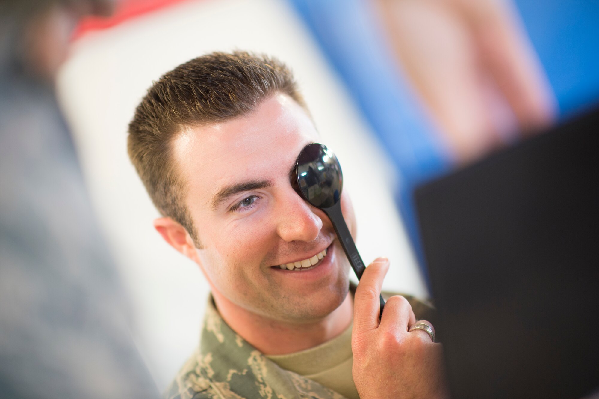 U.S. Air Force Airman 1st Class Daniel Rocheleau, of the Vermont Air National Guard, receives a vision exam with the 158th Fighter Wing Medical Squadron in South Burlington, Vt., June 6. The 158th Medical Squadron has become the first Air Guard base to process both Preventative Health Assessments and Occupational Health Physical Examinations in one large push, improving the medical experience for both sides, and creating a cost-saving and efficient format for other bases to emulate. (U.S. Air National Guard photo by Senior Airman Jon Alderman)