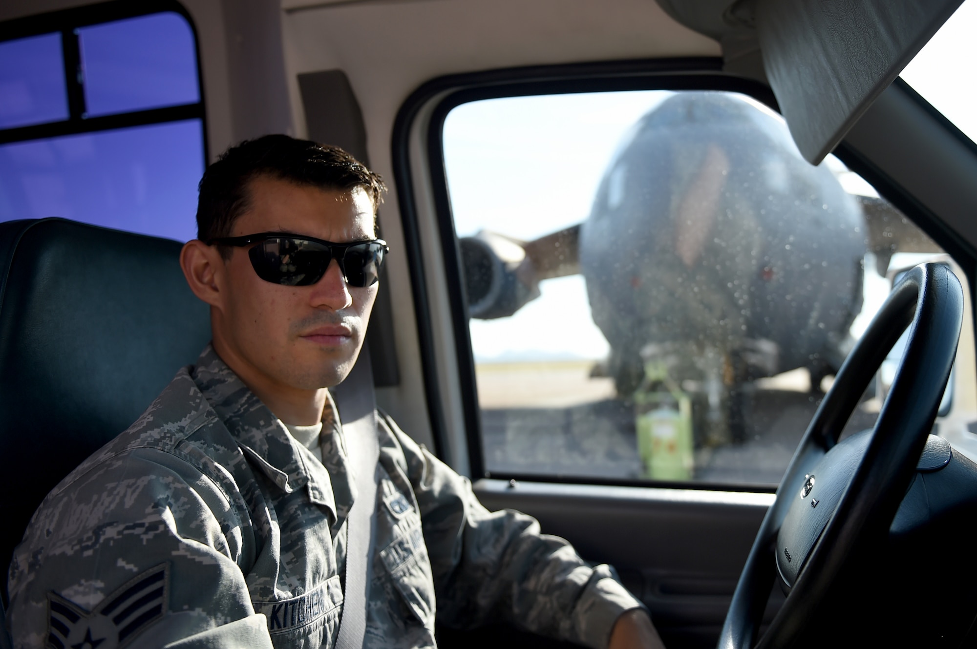 ALTUS AIR FORCE BASE, Okla. – U.S. Air Force Senior Airman Andrew Kitchen, 97th Logistics Readiness Squadron vehicle operations operator, waits to pick up aircrew members on the flightline, Sept. 3, 2015. Vehicle operators main responsiblities are taking aircrew members to and from the flightline and driving distinguished visitors around base. (U.S. Air Force photo by Airman 1st Class Kirby Turbak/Released)
