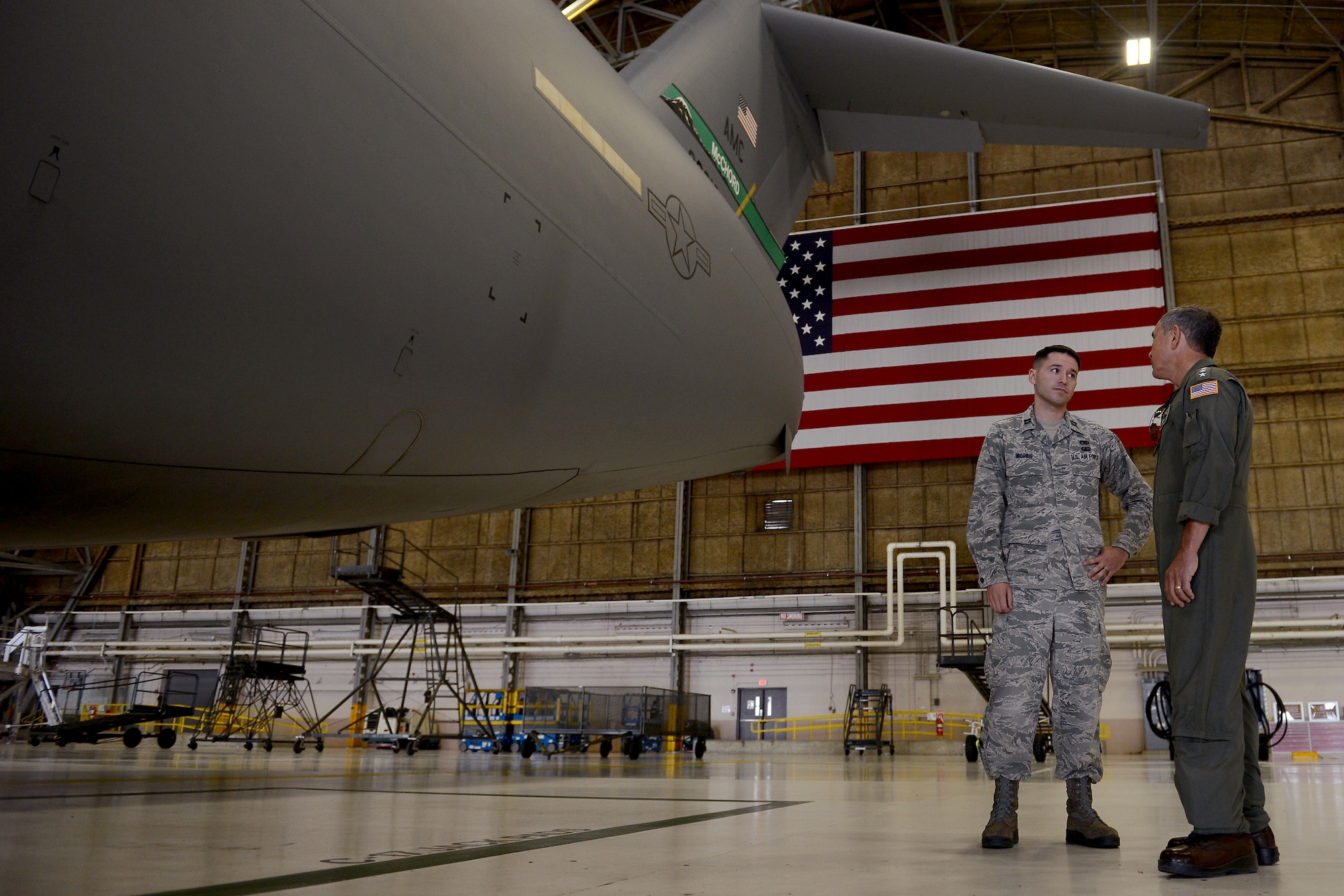 Capt. Alexander Morris (left) 62nd Maintenance Squadron flight commander, explains the capabilities of the Home Station Checks to Admiral Harry B. Harris Jr., Pacific Command commander, Sept. 8, 2015, at Joint Base Lewis-McChord, Wash. The purpose of HSC is to perform maintenance on the 48 C-17 Globemaster III’s belonging to the 62nd Airlift Wing. (U.S. Air Force photo/Staff Sgt. Tim Chacon)
