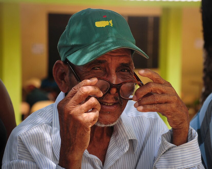 TRUJILLO, Honduras – Benjamin Pamistan, a patient from the remote depart of Gracias a Dios in eastern Honduras, dons a pair of glasses he received during Continuing Promise 2015 in Trujillo, Honduras, Aug. 29, 2015. Pamistan began losing his sight three years ago and was chosen by the Honduran Government to receive eye care during the U.S. Southern Command-sponsored exercise in Trujillo. (U.S. Air Force photo by Capt. Christopher Love)