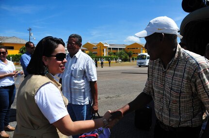 TRUJILLO, Honduras – Giselle Padilla, the Governor of Colon, greets passengers as they exit a Joint Task Force-Bravo CH-47 “Chinook” following a flight to Trujillo, Honduras, Aug. 27, 2015. Twenty-five patients and their escorts participated in the flight, in order to receive eye care as part of Continuing Promise 2015, a U.S. Southern Command-sponsored exercise that builds partnership with nations throughout Central and South America and the Caribbean. (U.S. Air Force photo by Capt. Christopher Love)