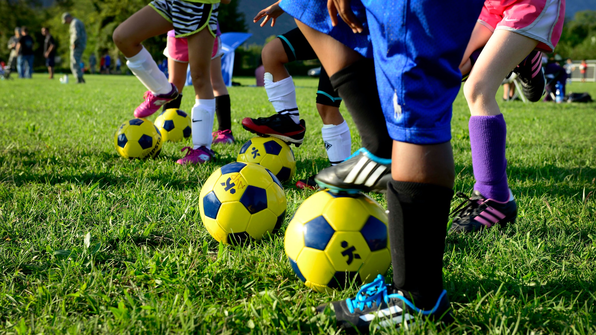 Team Aviano youth wait for instructions during soccer practice, Sept. 8, 2015, at Aviano Air Base, Italy. The Aviano Youth Program hosts soccer practice for different age groups twice a week. The soccer season, which ends Oct. 31, is the largest AYP program with more than 300 participants. (U.S. Air Force photo by Senior Airman Areca T. Bell/Released)