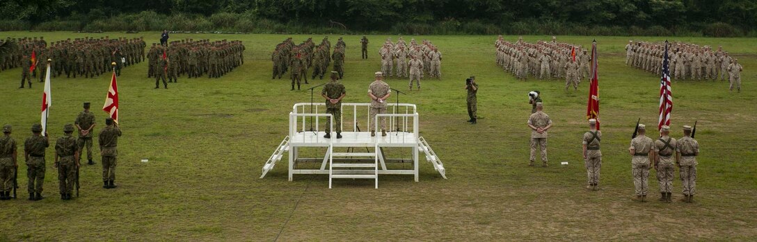 U.S. Marines and Japanese Ground Self Defense Force members stand in formation for the opening ceremony of Forest Light 16-1 at Camp Imazu, Takashima, Japan, Sept. 6, 2015. Forest Light will take place Sept. 7-18 with approximately 240 Marines working next to 350 JGSDF members. The exercise will consist of combined mortar live fire, establishing forward arming and refueling points training, combined helicopter borne skills and combined-arms training. The JGSDF members are from 50th Infantry Regiment, 14th Brigade. The Marines are with 1st Battalion, 2nd Marine Regiment currently assigned to 4th Marine Regiment, 3rd Marine Division, III Marine Expeditionary Force.