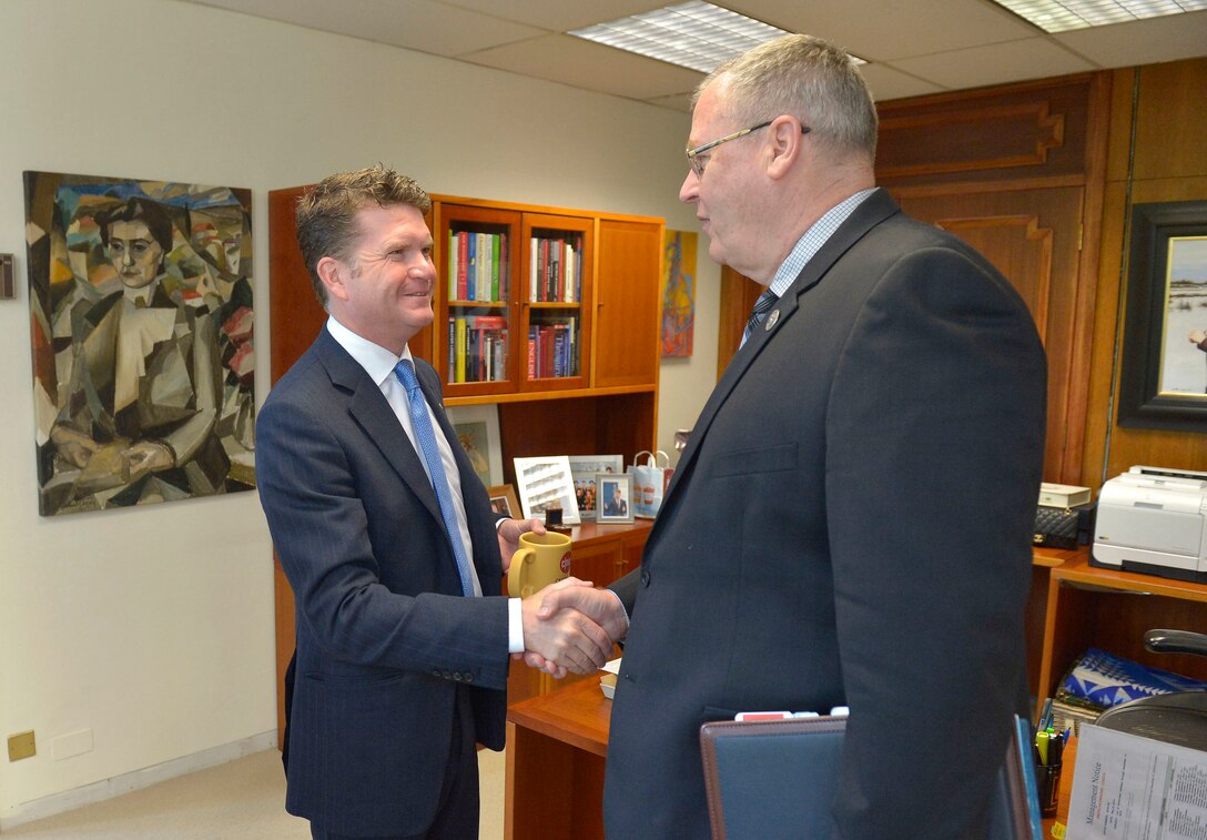 U.S. Deputy Defense Secretary Bob Work, right, shakes hands with U.S. Ambassador to the United Kingdom Matthew Barzun as they prepare to meet in London, Sept. 10, 2015. DoD photo by Glenn Fawcett