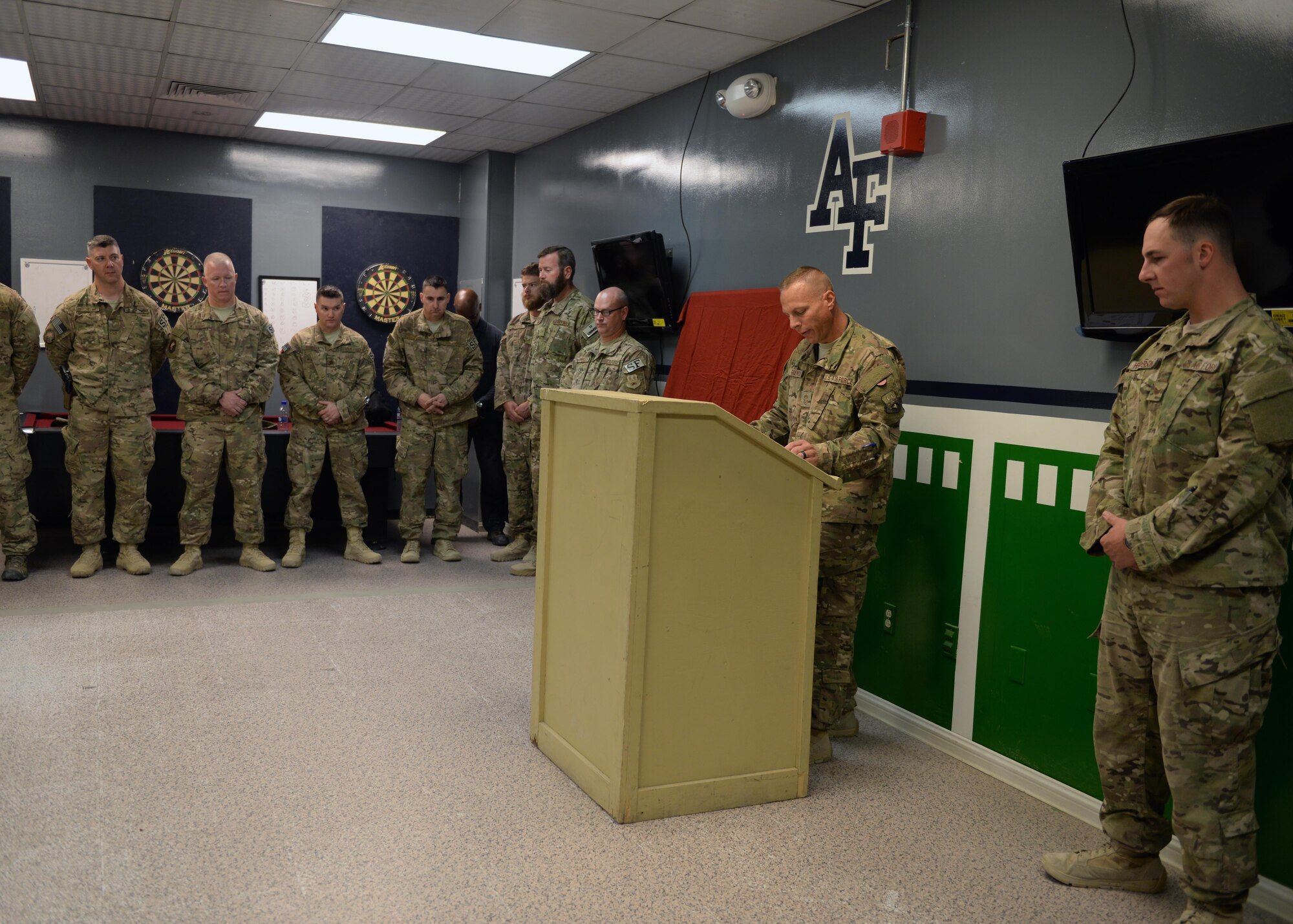 U.S. Air Force Chief Master Sgt. Matthew Grengs, 455th Air Expeditionary Wing command chief, gives a speech during a dedication remembrance ceremony for fallen hero Staff Sgt. Todd Lobraico Sept. 5, 2015, at Bagram Airfield, Afghanistan. Members of BAF gathered to remember the sacrifice made by Lobraico when he lost his life during a fire fight against enemy forces while deployed here in 2013. (U.S. Air Force photo by Senior Airman Cierra Presentado/Released)