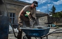 Airman 1st Class Cole Kasten, a 52nd Civil Engineer Squadron pavement and heavy equipment operator, mixes cement for a ramp at Public School No. 4 in Gori, Georgia, Aug. 28, 2015. Kasten and a team of Airmen built the ramp to give disabled students at the school safe access into the gymnasium. Humanitarian and civic assistance projects enhance operational readiness of military personnel while providing mutual support to the host
nation&#39;s population. (U.S. Air Force photo/Staff Sgt. Sara Keller)
