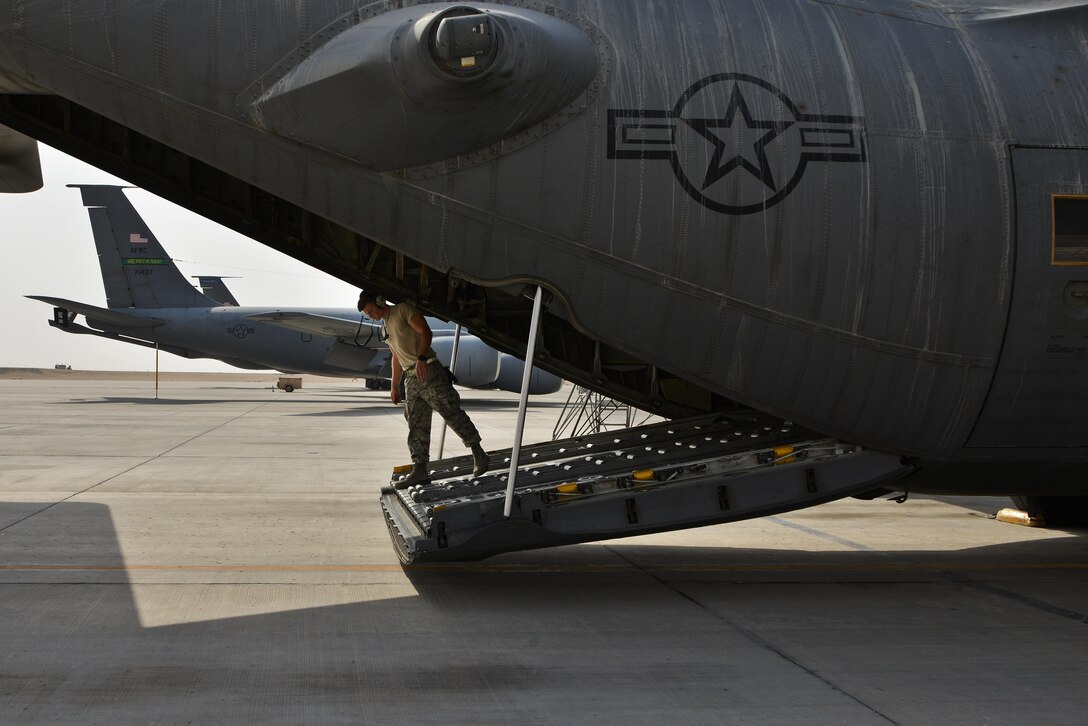 Staff Sgt. Jordan Hale, 379th Expeditionary Aircraft Maintenance Squadron, 746th Expeditionary 
Aircraft Maintenance Unit, looks out  the back of a C-130 Hercules to ensure proper extension of the bay door during a routine maintenance inspection September 9, 2015 Al Udeid Air Base, Qatar. The 746th AMU airmen are responsible for ensuring aircraft are maintained to exact standards to support Operation Inherent Resolve. Hale is a deployed member of the  911th Airlift Wing, Pittsburgh International Airport Air Reserve Station, Pa. (U.S. Air Force photo/Staff Sgt. Alexandre Montes)  

