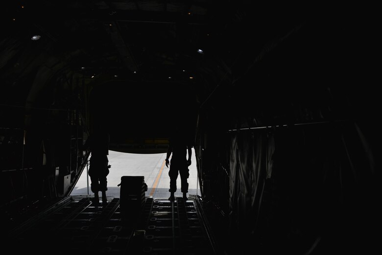 Senior Airman Jacob Elensky and Senior Airman Ryan Patrick, 379th Expeditionary Aircraft Maintenance Squadron, 746th Expeditionary Aircraft Maintenance Unit, close the bay doors of a C-130 Hercules after completing their portion of inspections September 9, 2015 at Al Udeid Air Base, Qatar. The 746th AMU airmen are responsible for ensuring aircraft are maintained to exact standards to support Operation Inherent Resolve. Elensky and Patrick are deployed members of the 911th Airlift Wing, Pittsburgh International Airport Air Reserve Station, Pa. (U.S. Air Force photo/Staff Sgt. Alexandre Montes)  
