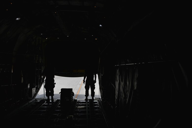 Senior Airman Jacob Elensky and Senior Airman Ryan Patrick, 379th Expeditionary Aircraft Maintenance Squadron, 746th Expeditionary Aircraft Maintenance Unit, close the bay doors of a C-130 Hercules after completing their portion of inspections September 9, 2015 at Al Udeid Air Base, Qatar. The 746th AMU airmen are responsible for ensuring aircraft are maintained to exact standards to support Operation Inherent Resolve. Elensky and Patrick are deployed members of the 911th Airlift Wing, Pittsburgh International Airport Air Reserve Station, Pa. (U.S. Air Force photo/Staff Sgt. Alexandre Montes)  
