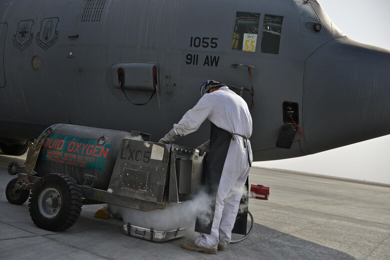 Senior Airman Matthew Krzywiecki, 379th Expeditionary Aircraft Maintenance Squadron, 746th Expeditionary Aircraft Maintenance Unit, purges his tank of liquid oxygen before recharging a C-130 Hercules September 9, 2015 at Al Udeid Air Base, Qatar. The 746th AMU cryogenics airmen work with liquid nitrogen and liquid oxygen that is recharged into aircraft, providing aircrews with pure oxygen at altitude during missions in support of Operation Inherent Resolve.  Krzywiecki is a deployed member from the 911th Airlift Wing, Pittsburgh International Airport Air Reserve Station, Pa. (U.S. Air Force photo/Staff Sgt. Alexandre Montes)  