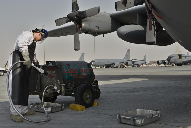 Senior Airman Matthew Krzywiecki, 379th Expeditionary Aircraft Maintenance Squadron, 746th Expeditionary Aircraft Maintenance Unit, prepares to recharge a C-130 Hercules with liquid oxygen September 9, 2015 at Al Udeid Air Base, Qatar. The 746th AMU cryogenics airmen work with liquid nitrogen and liquid oxygen that is recharged into aircraft, providing aircrews with pure oxygen at altitude during missions in support of Operation Inherent Resolve. Krzywiecki is a deployed member from the 911th Airlift Wing, Pittsburgh International Airport Air Reserve Station, Pa.(U.S. Air Force photo/Staff Sgt. Alexandre Montes)  